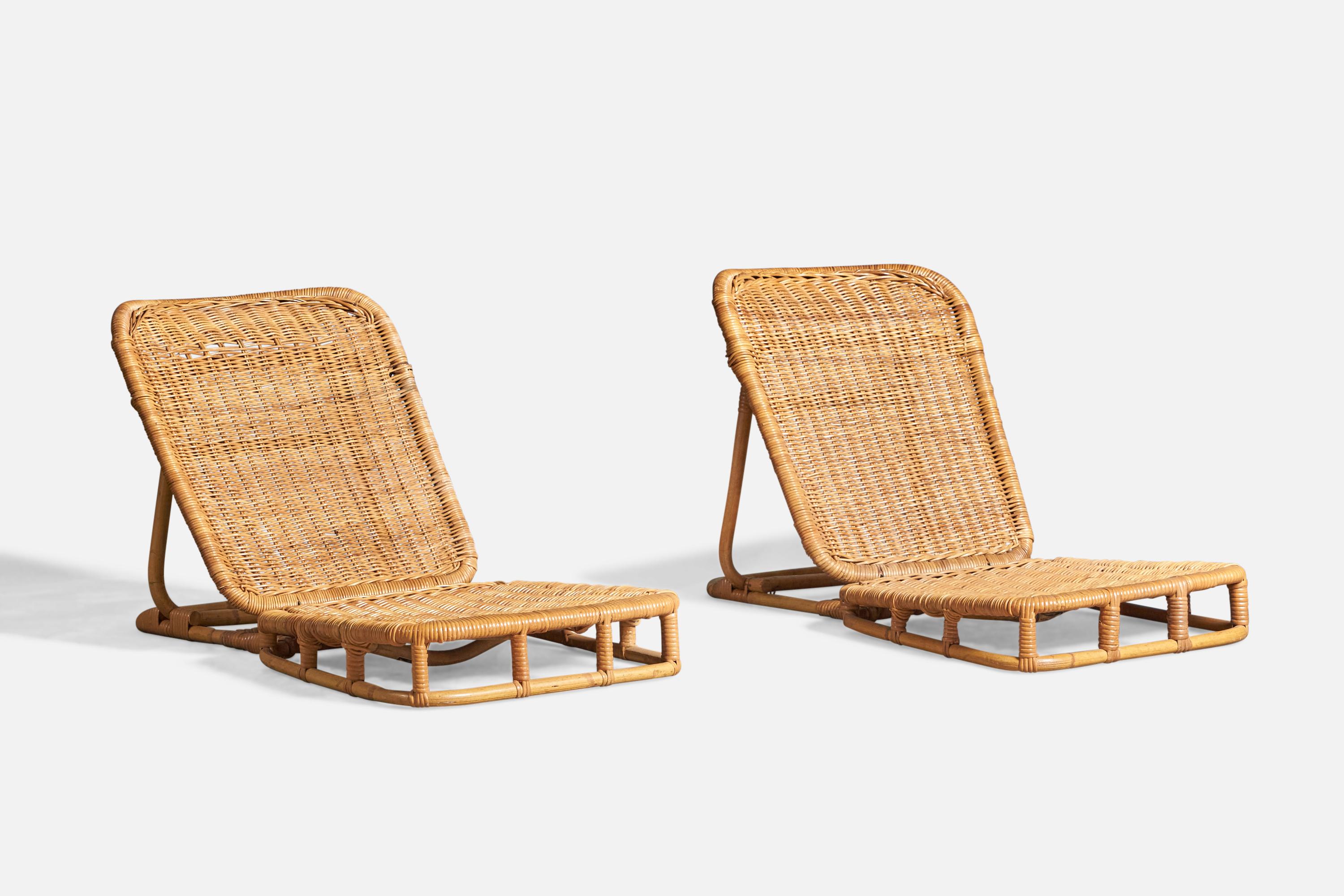A pair of foldable rattan and bamboo low folding lounge chairs, designed and produced by Calif-Asia, USA, c. 1950s.
