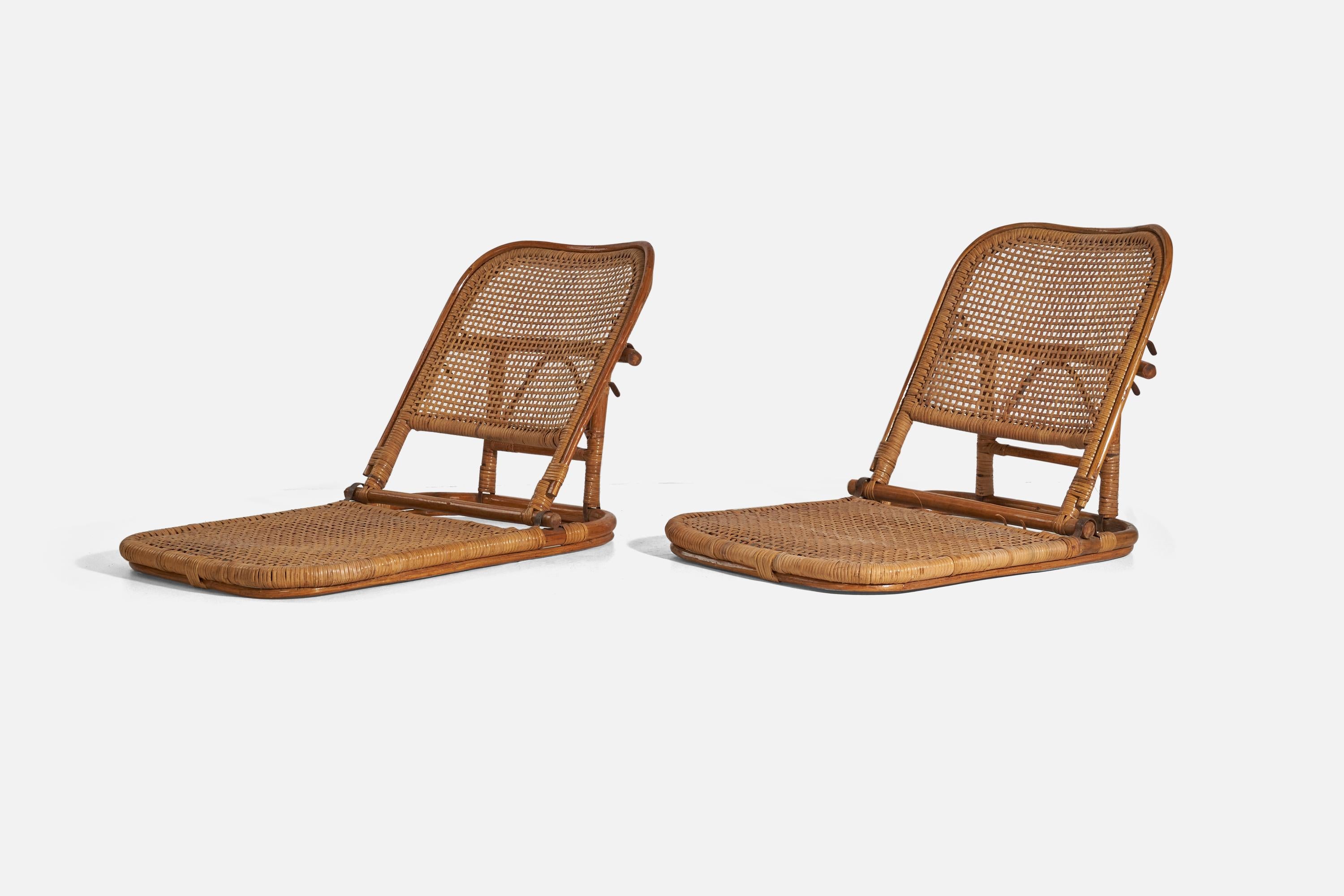 A pair of bamboo, rattan and metal folding lounge chairs designed and produced in the USA, 1950s.