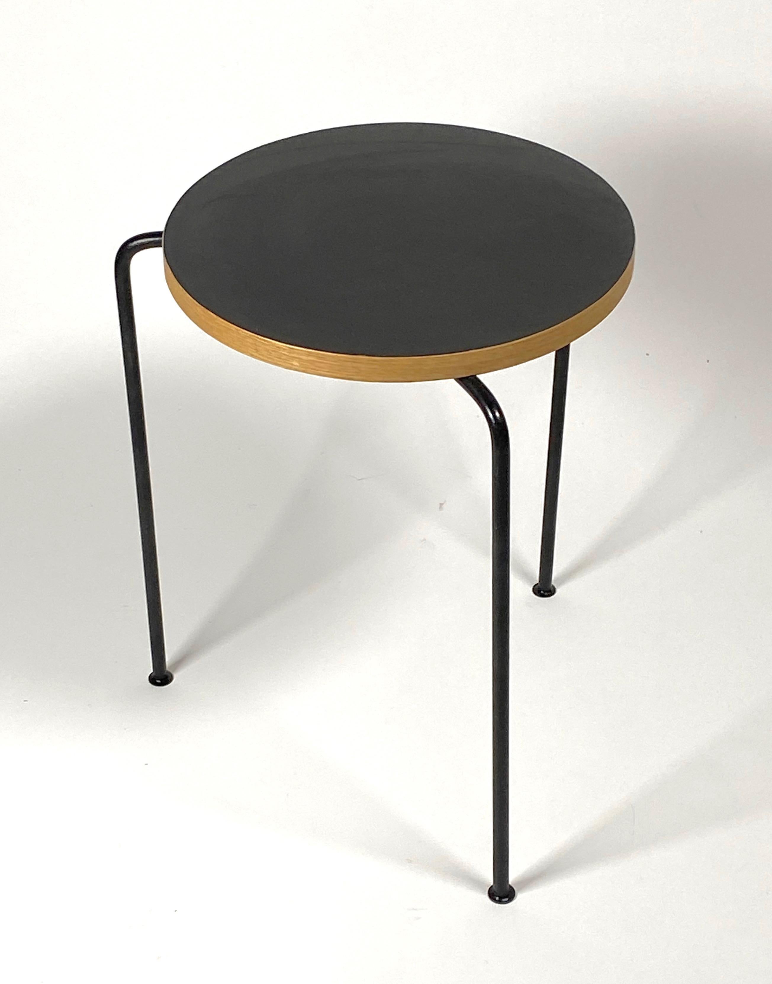 Melamine laminate, wood and iron frame stool, this three legged stool is attributed to Bay Area designer Luther Conover, normally the stools are constructed using Philippine Mahogany for the tops, the laminate is a unusual variation on this design.