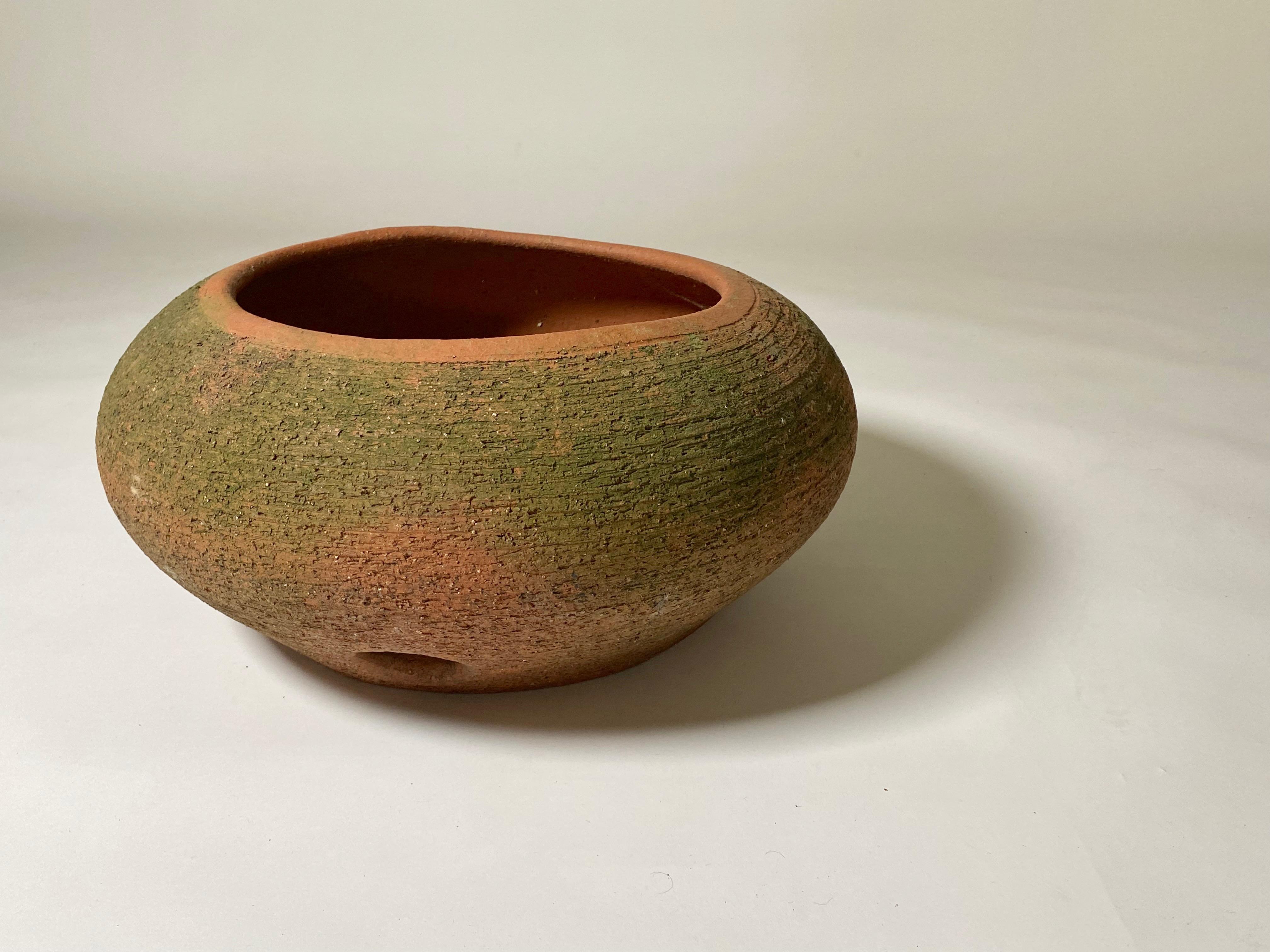 Adobe hose pot designed by California artist Stan Bitters, made with a special formulation of adobe clay created by Hans Sumpf. This one was created in the 1970s and are designed to hold the garden hose, keep it out of site and tidy, signed by the