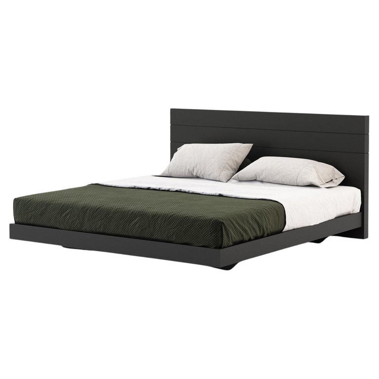 California King Size Bed Featuring a Wooden Headboard and Simple