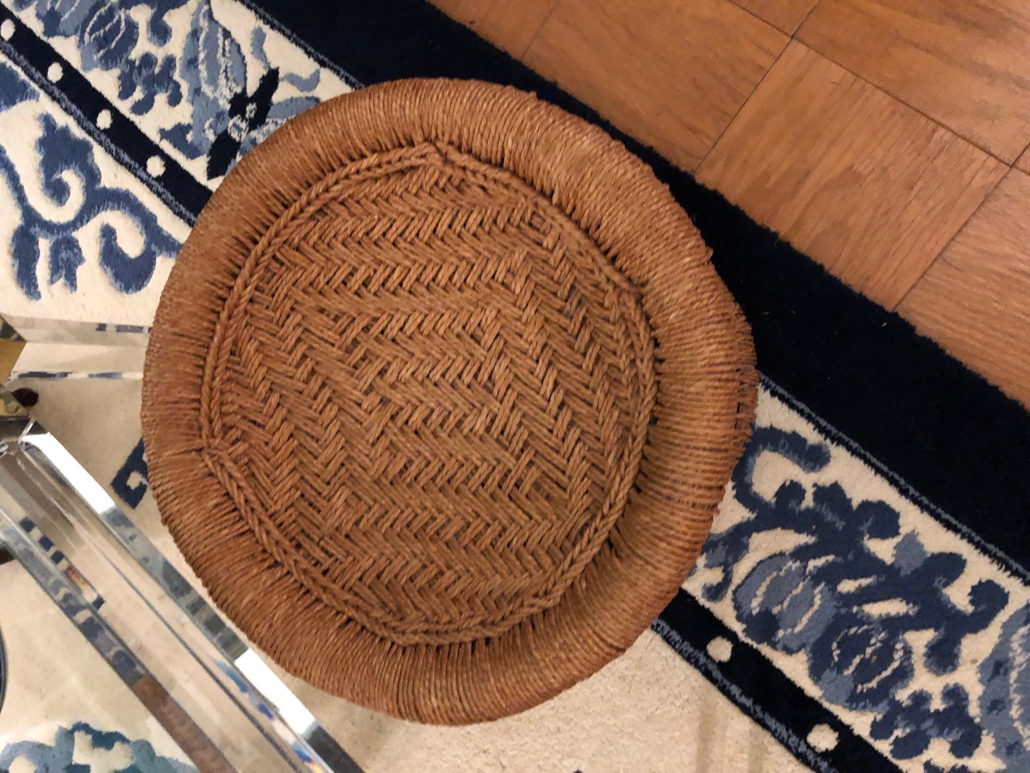 Sturdy and handsome natural reed body with woven rush top and accents stool, popularized by California craftsmen in the 1960s-1970s. Note the basket weave motif in the top woven area. With the addition of a round glass top, the stool could easily