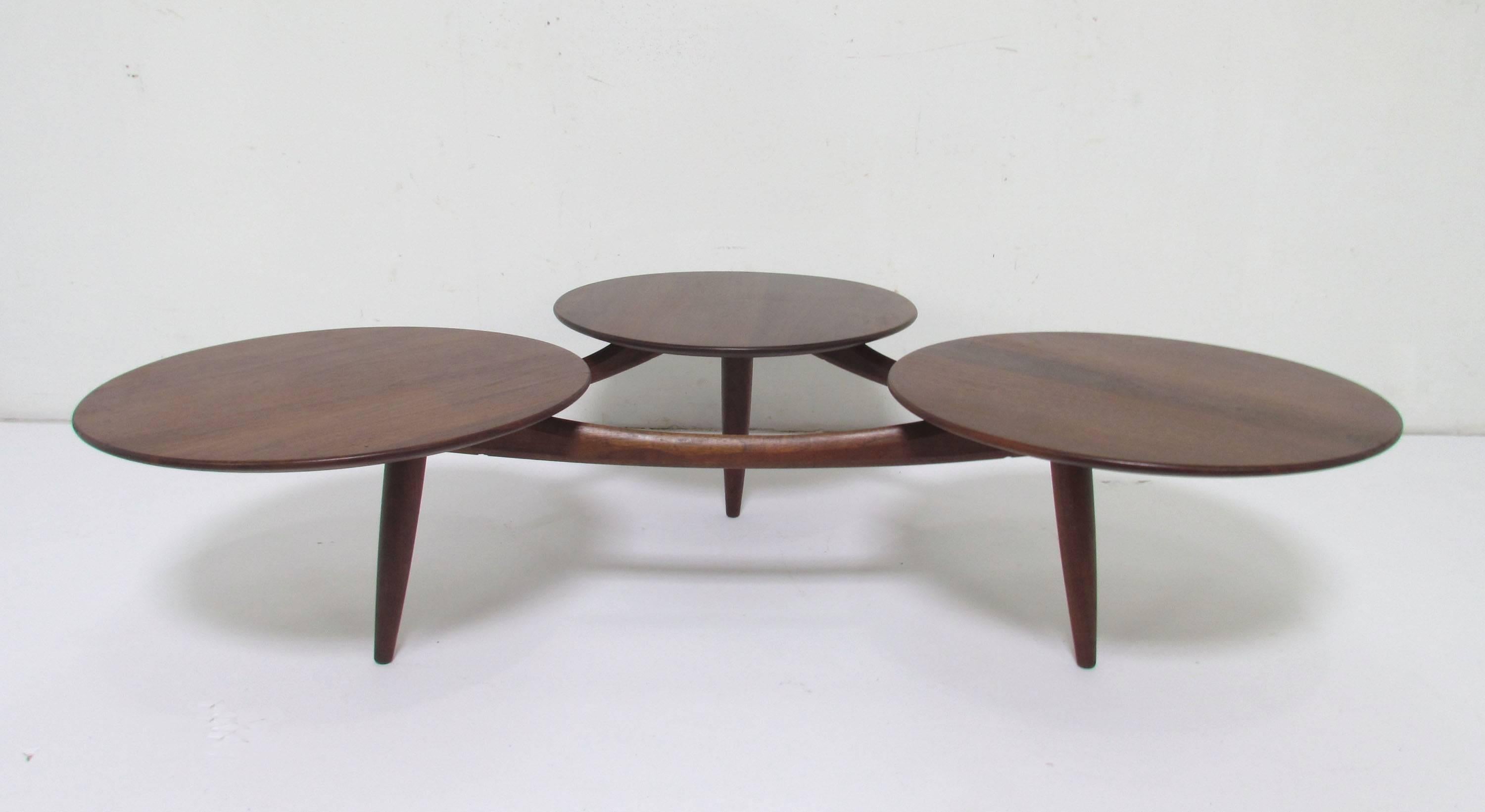 Midcentury walnut coffee table in the manner of Greta Grossman, consisting of three 20