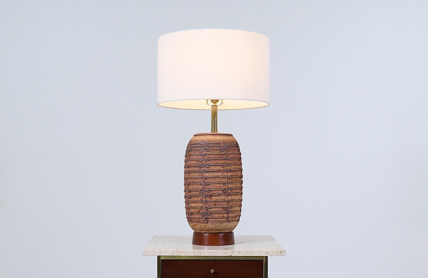 California modern ceramic table lamp by Bob Kinzie.

________________________________________

Transforming a piece of Mid-Century Modern furniture is like bringing history back to life, and we take this journey with passion and precision. With over