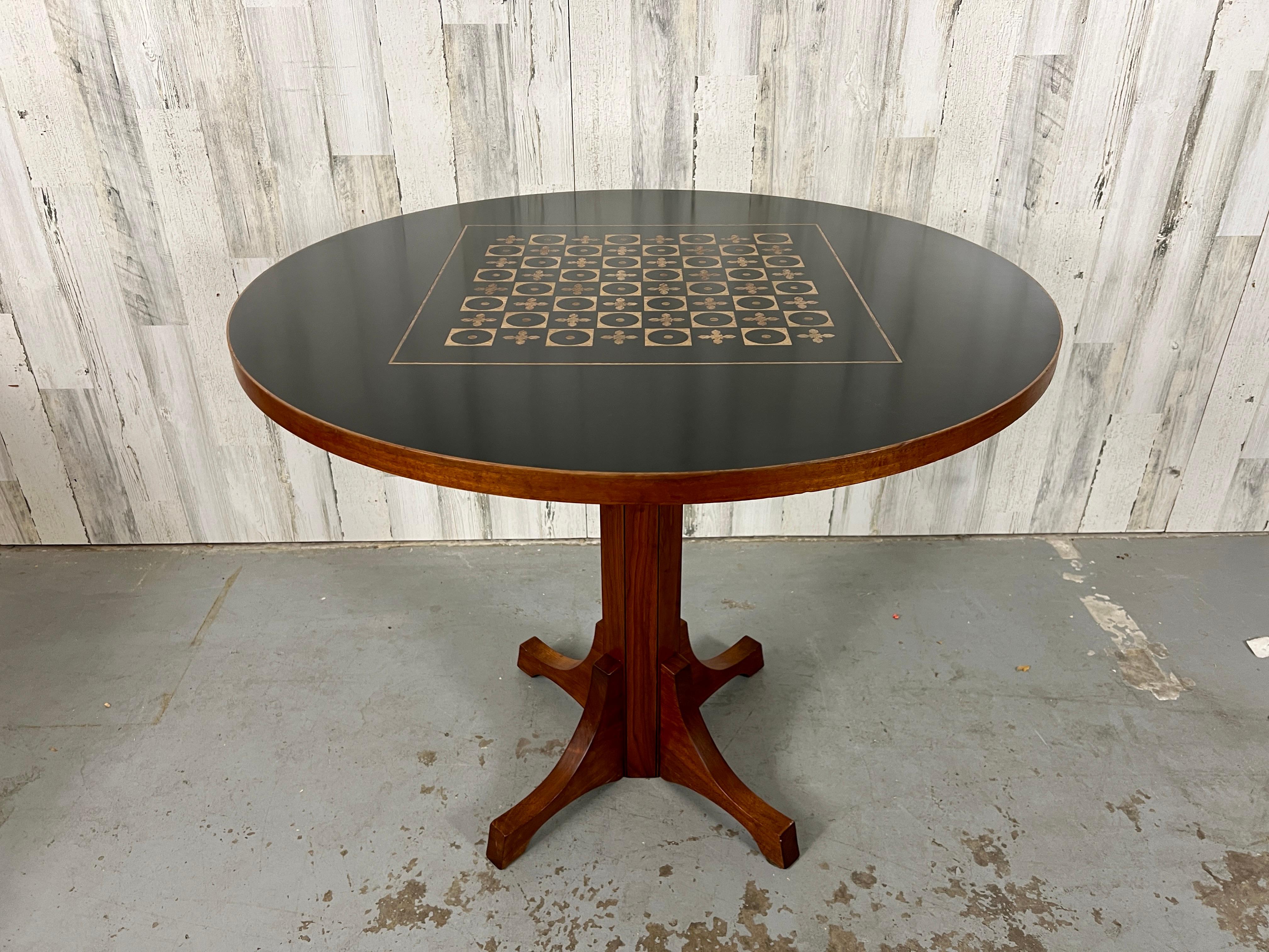 A great combination of walnut and resin round chess table. There is a intricate design of cross and circle    of wood cast in black resin. You cant miss Frank Rohloff signature design walnut with black resin.