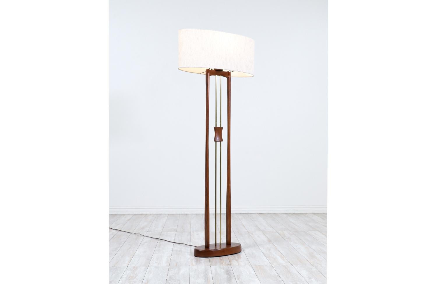 Dimensions:

59in H x 14.50in W x 7.50in D

Lamp Shade: 10in H x 24in W x 9in D

________________________________________

Transforming a piece of Mid-Century Modern furniture is like bringing history back to life, and we take this journey with