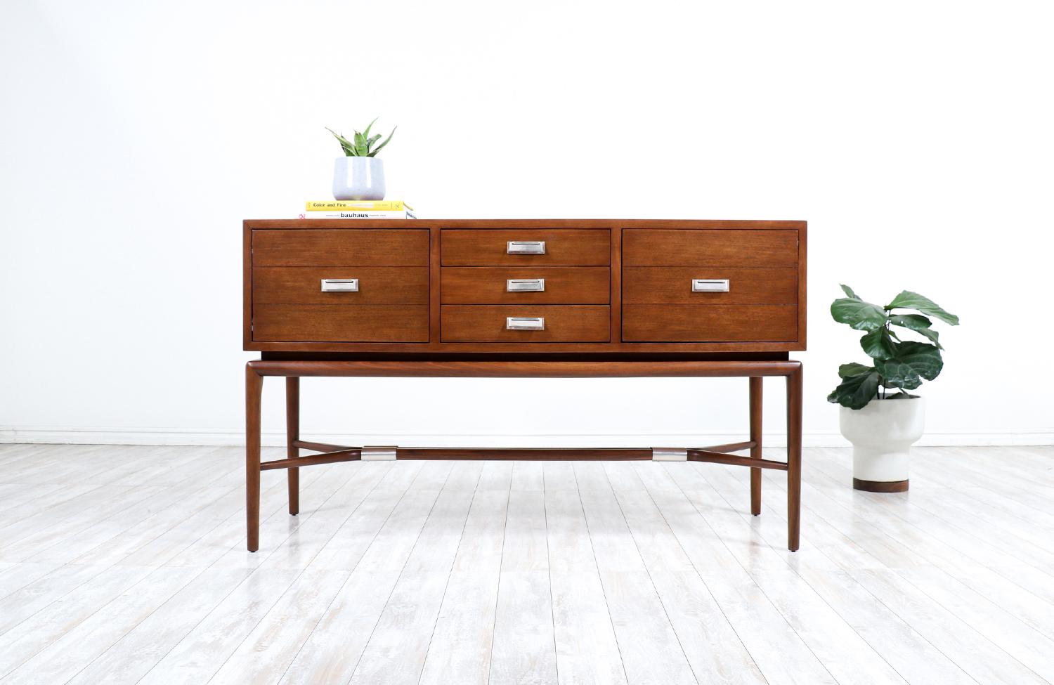 California modern console table by Maurice Bailey for Monteverdi-Young.

________________________________________

Transforming a piece of Mid-Century Modern furniture is like bringing history back to life, and we take this journey with passion and