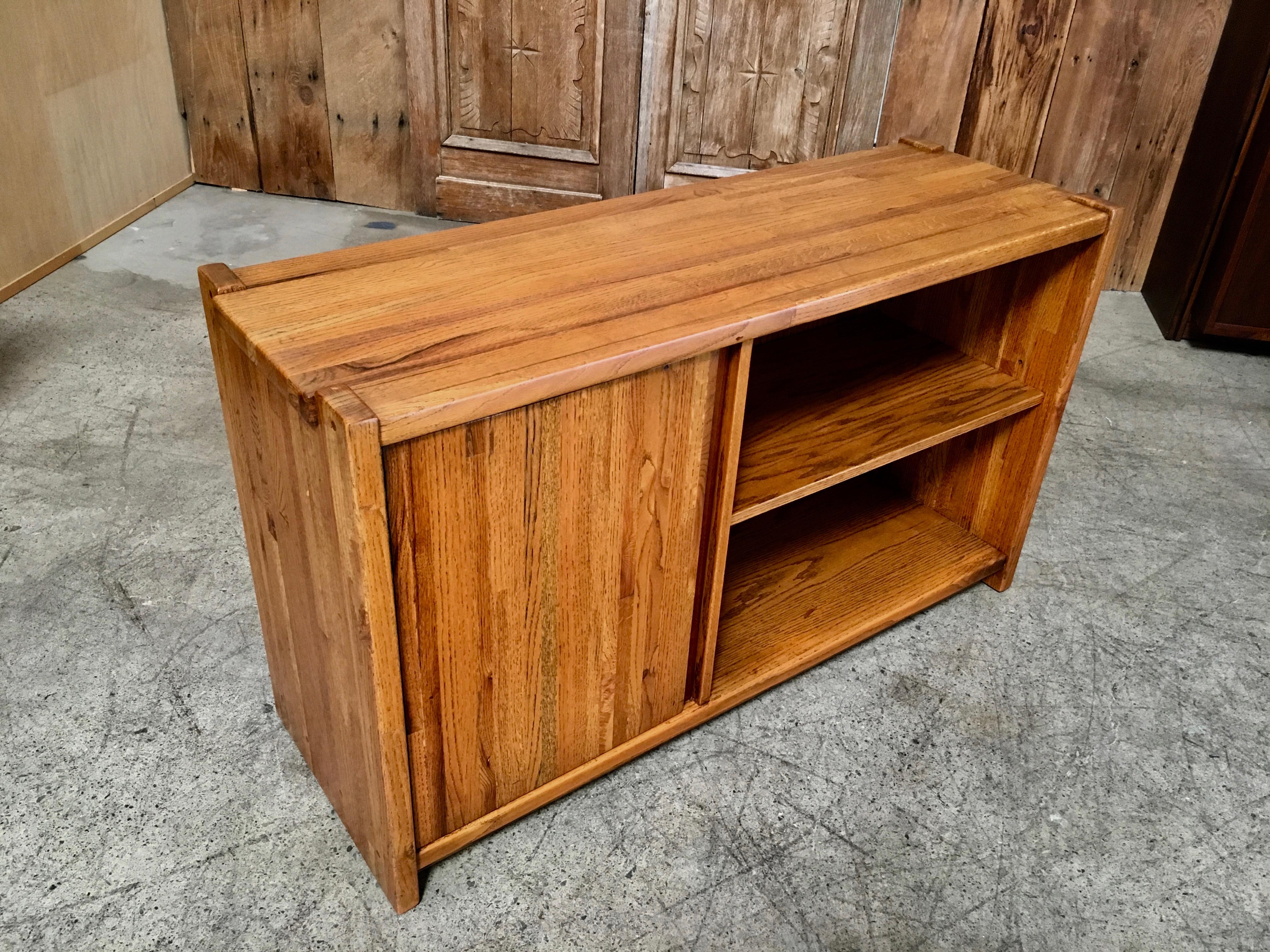 Solid oak butcher block construction with exposed dowels and walnut accent
This piece can be used for a entry way or media console
In the style of Lou Hodges.