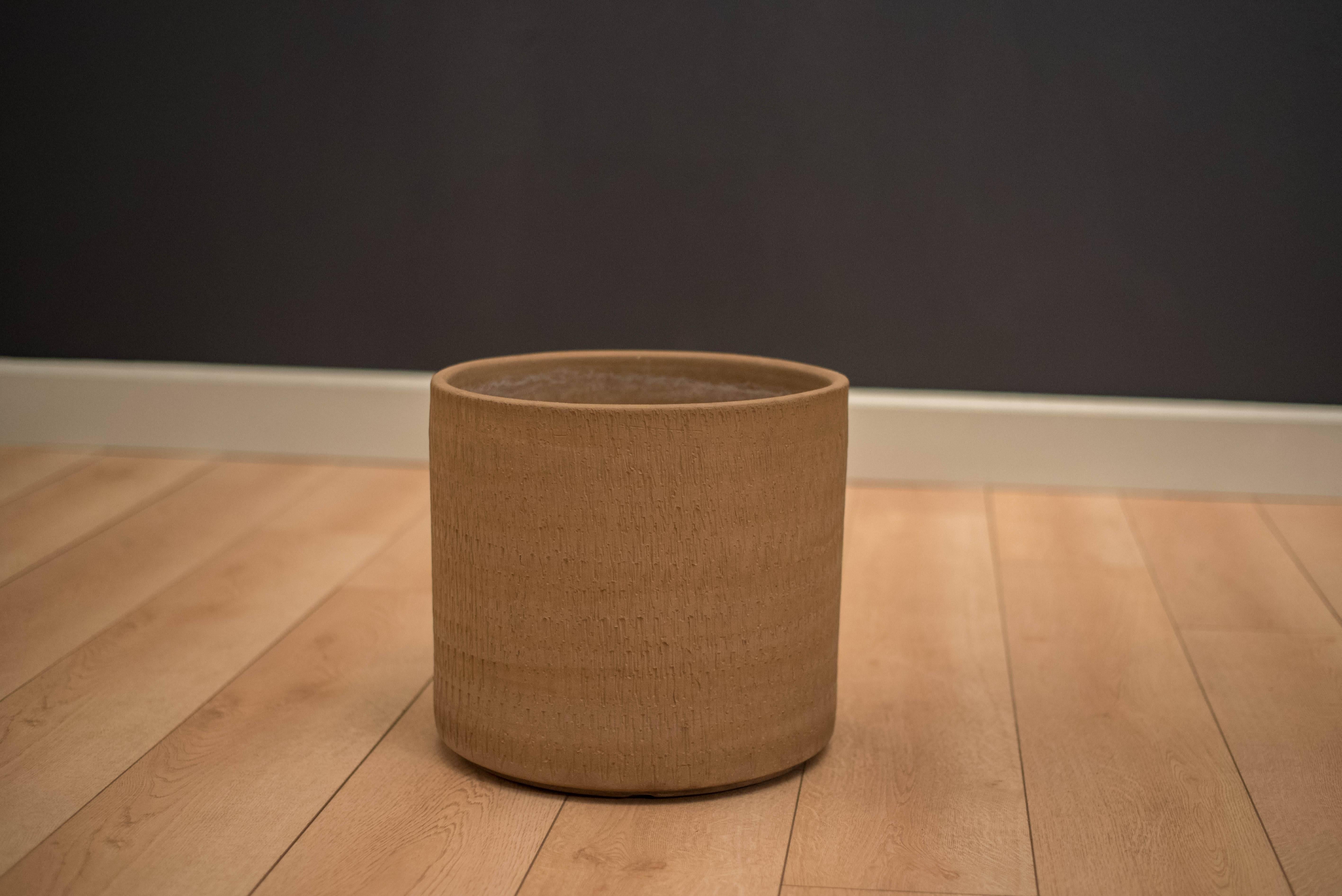 Mid-Century Modern Sgraffito ceramic planter made by Gainey Ceramics. This piece can be used both indoor or outdoor and displays a unique etched design with a neutral matte brown finish.