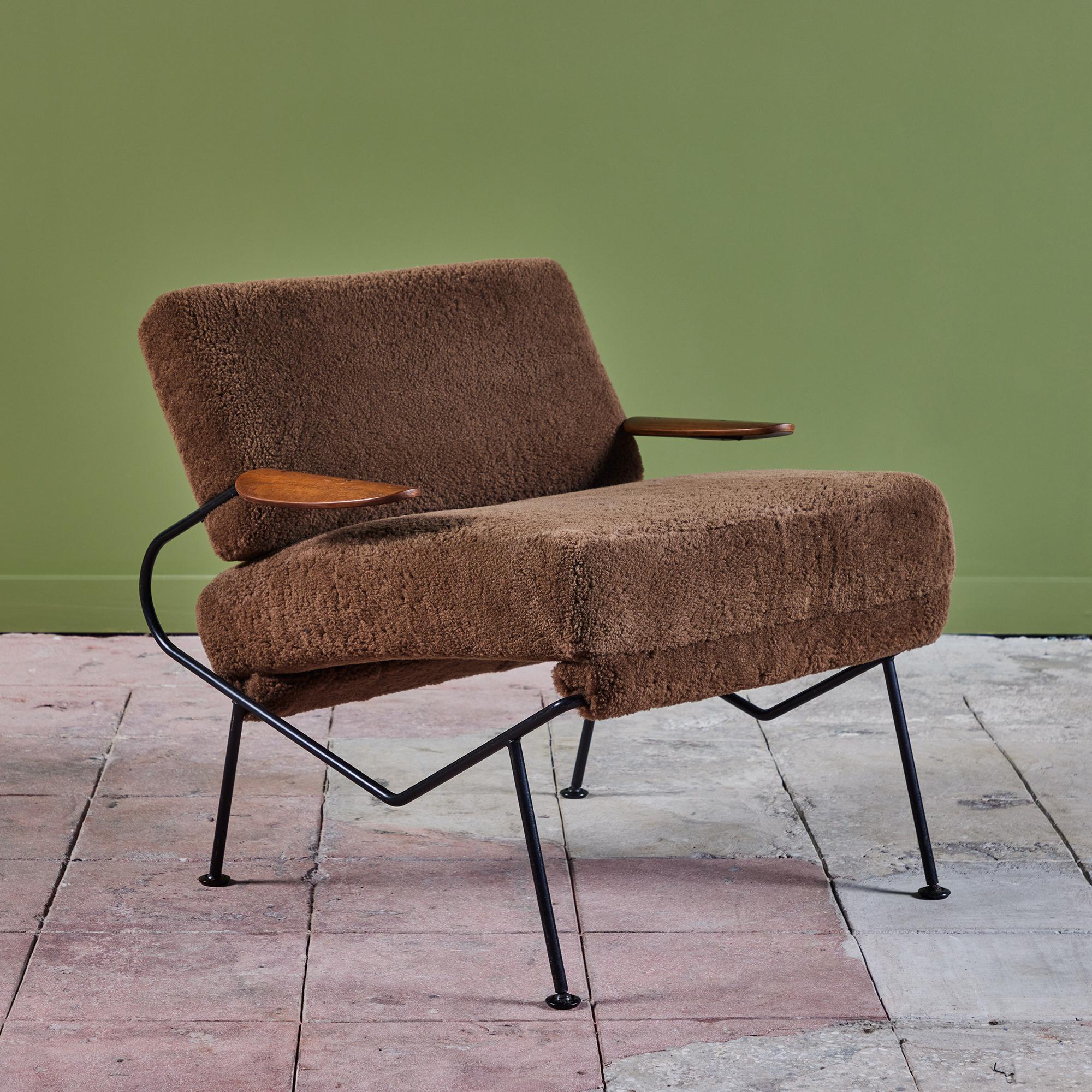 Lounge chair designed by California-based designer Dan Johnson and produced in the mid-1950s by Selig. The lightweight wire frame has a square seat- and back cushion and angled legs. Each arm has a petal-shaped armrest of molded
