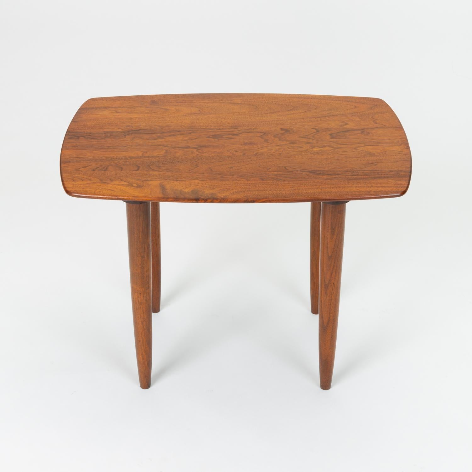 Produced by Ace-Hi of Gardena, Calif., the Prelude line of furniture featured solid walnut construction and simplified (but never reductive) purity of form. This Prelude table has a truncated surfboard shape, echoing the lines of their popular