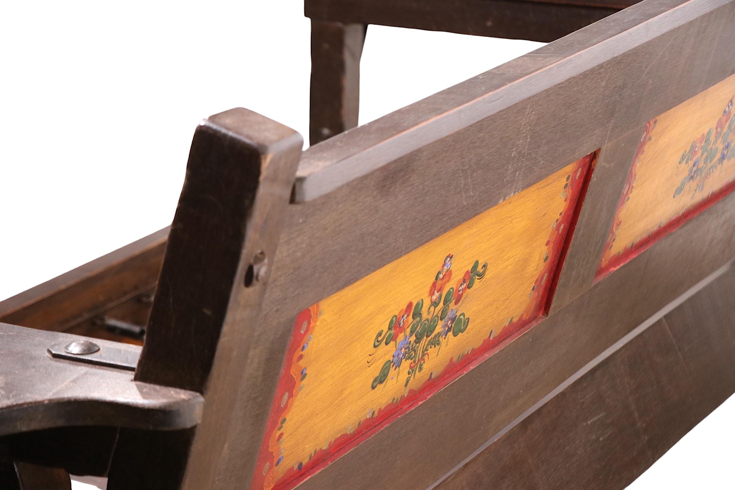 Incredible full size sofa by the Monterey Furniture Company, made in California, circa 1930's.
 The sofa features a solid wood ( probably Alder Wood ) frame with heavy wrought iron joinery, and  signature hand painted decorative panels at the back
