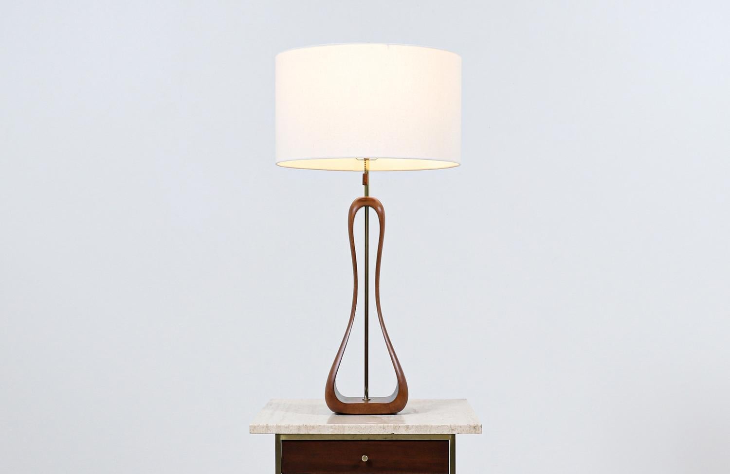 Dimensions:
33.50in H x 7.50in W x 5.50in D

Lamp shade:
10in H x 17in W x 17in D.

_______________________________________________________________

Transforming a piece of Mid-Century Modern furniture is like bringing history back to life, and we