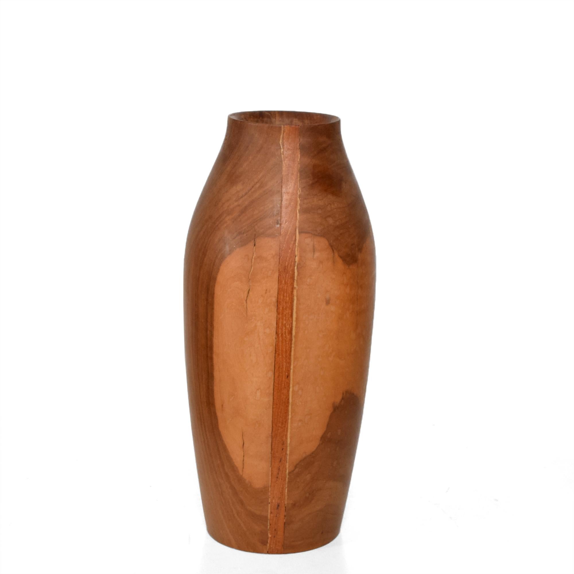 Mid-Century Modern sculptural turned wood vase after designs of master wood turner Rude Osolnik.
Unmarked no information on the maker, 1970s, California.
Dimensions: 11