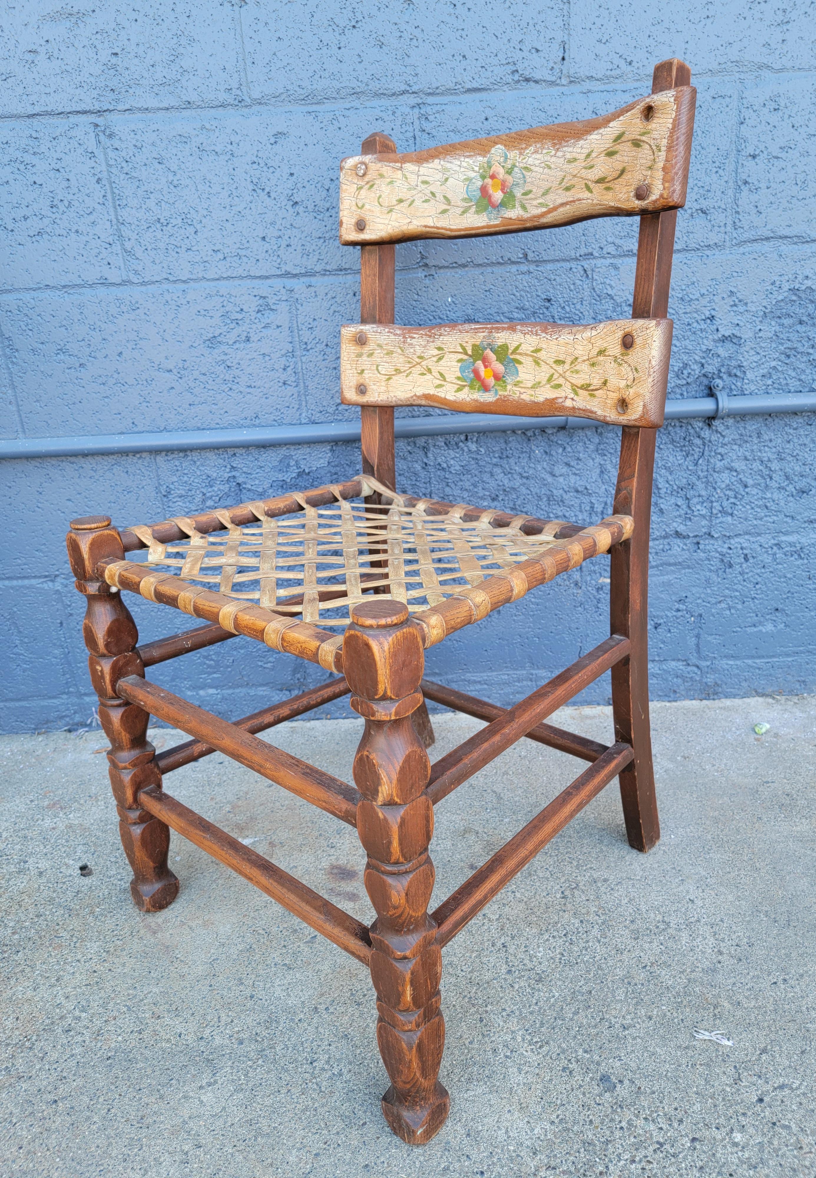 Good set of 4 California Rancho dining chairs with original hand painted floral back slats and woven rawhide seats. Circa. 1930's. In the manner of Monterey or Coronado Furniture. Unsigned.