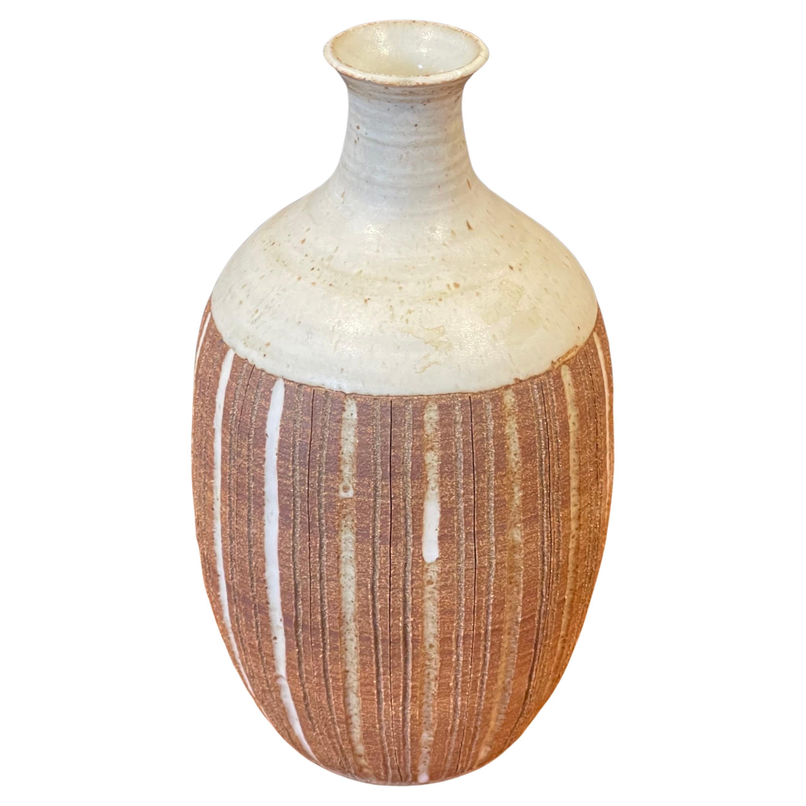 A very nice California studio pottery stoneware vase with beautiful tan and brown earth tones by San Diego artist Barbara Moorehead, circa 1970s. The vessel has wonderful design, look and form and measures 5.5