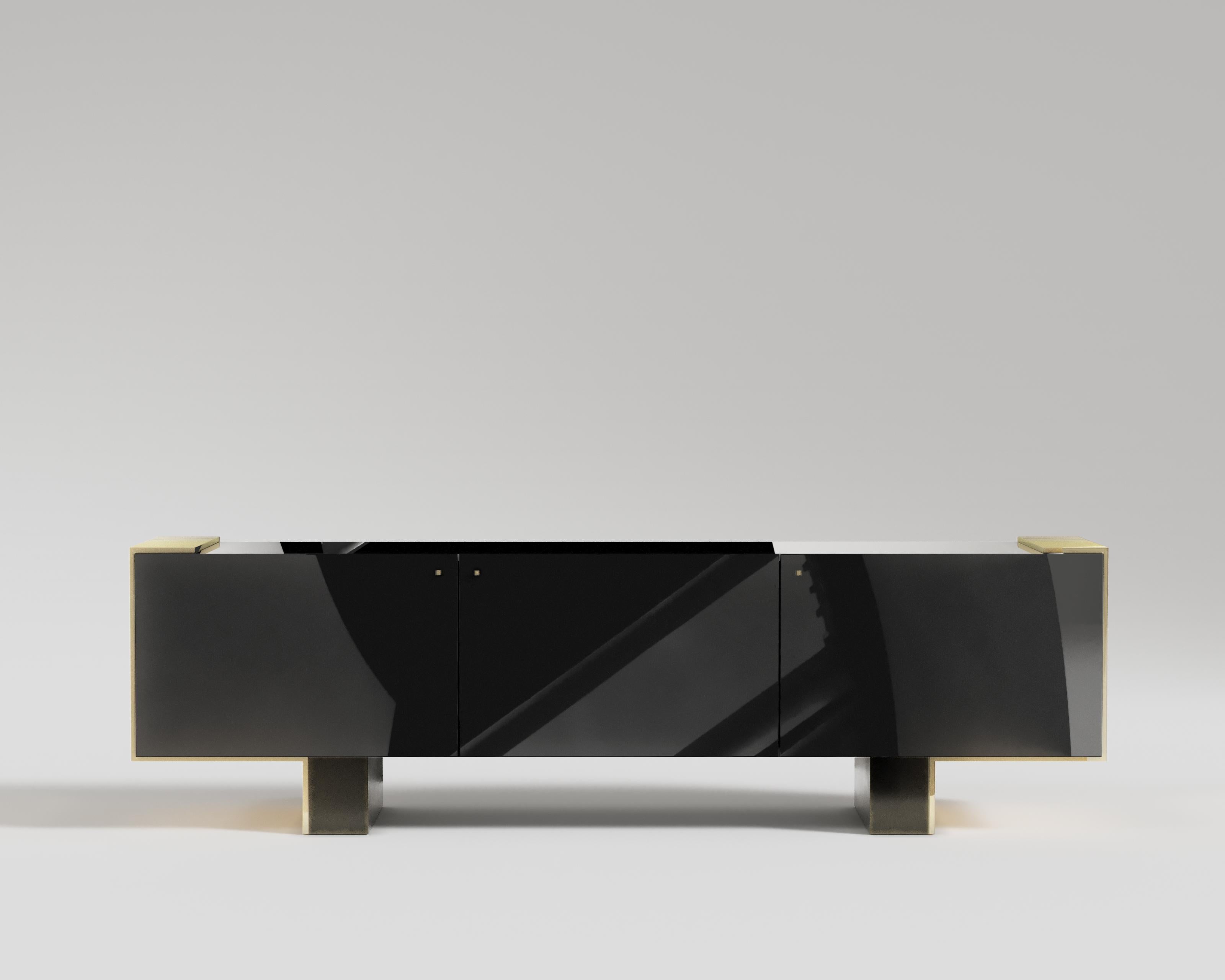 Câline Console
The Câline Console is a modern luxury piece with hints of industrial trends and contemporary flare. With a sleek, tailored design, Câline is well suited for a sophisticated home that yearns for a touch of gold. Black lacquer and
