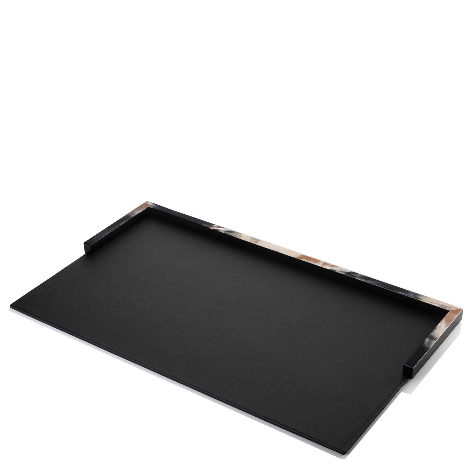 Boasting prized materials and refined lines, our Calipso desk blotter will ensure a smooth work area while protecting the surface of your desk. Crafted of premium black Tosca leather (cat. Super), this pad features an elegant semi-rectangular frame