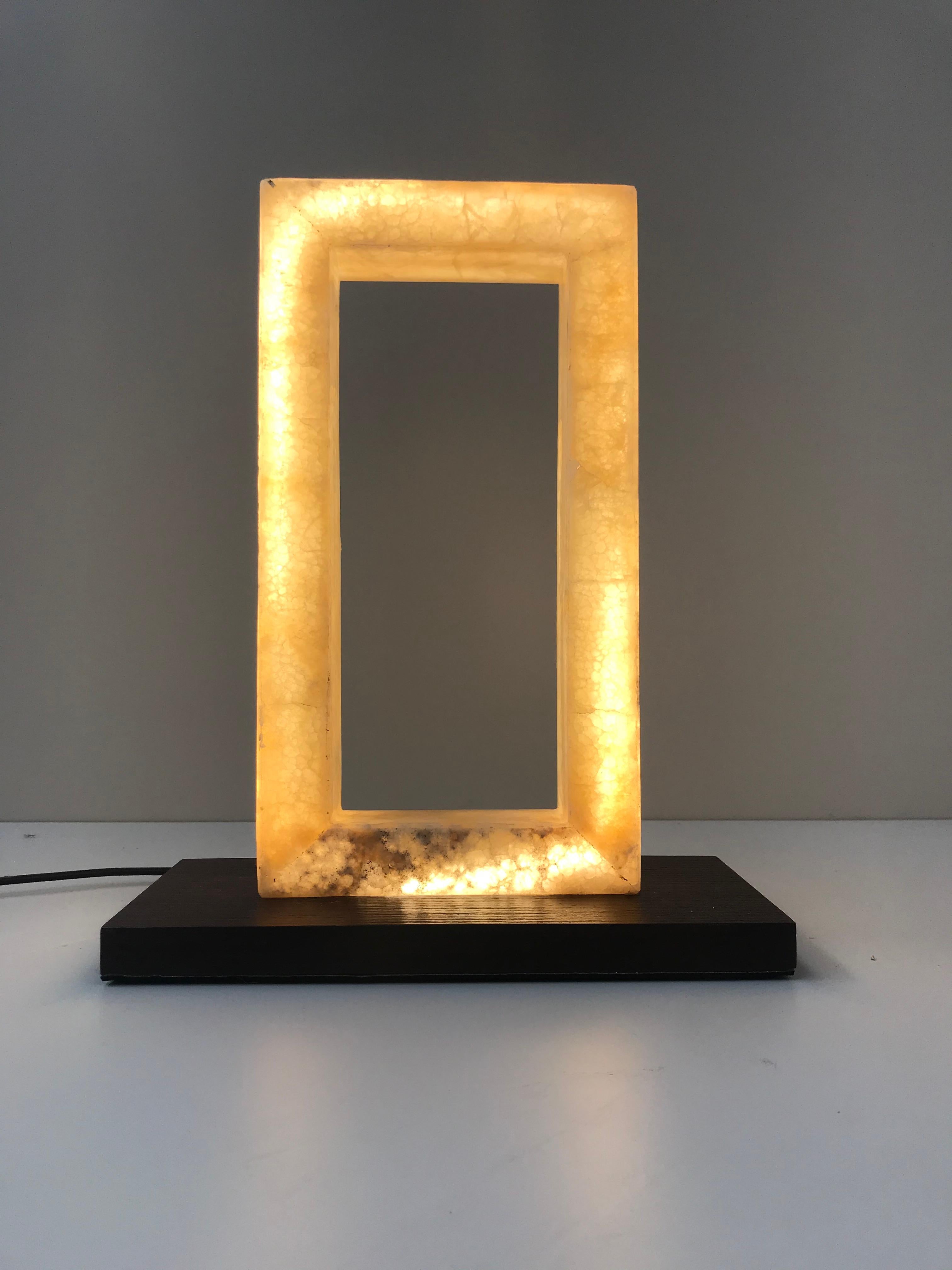 Calipso Table Lamp by G.Luce
Dimensions: W 27 x D 12 x H 32 cm
Materials: Layered Open Pore Wood and Amber Onyx Frame.  
Weight: 1.5 Kg. 

G.Luce is the result of a thirty-year history of commitment, research and collaboration with a network of