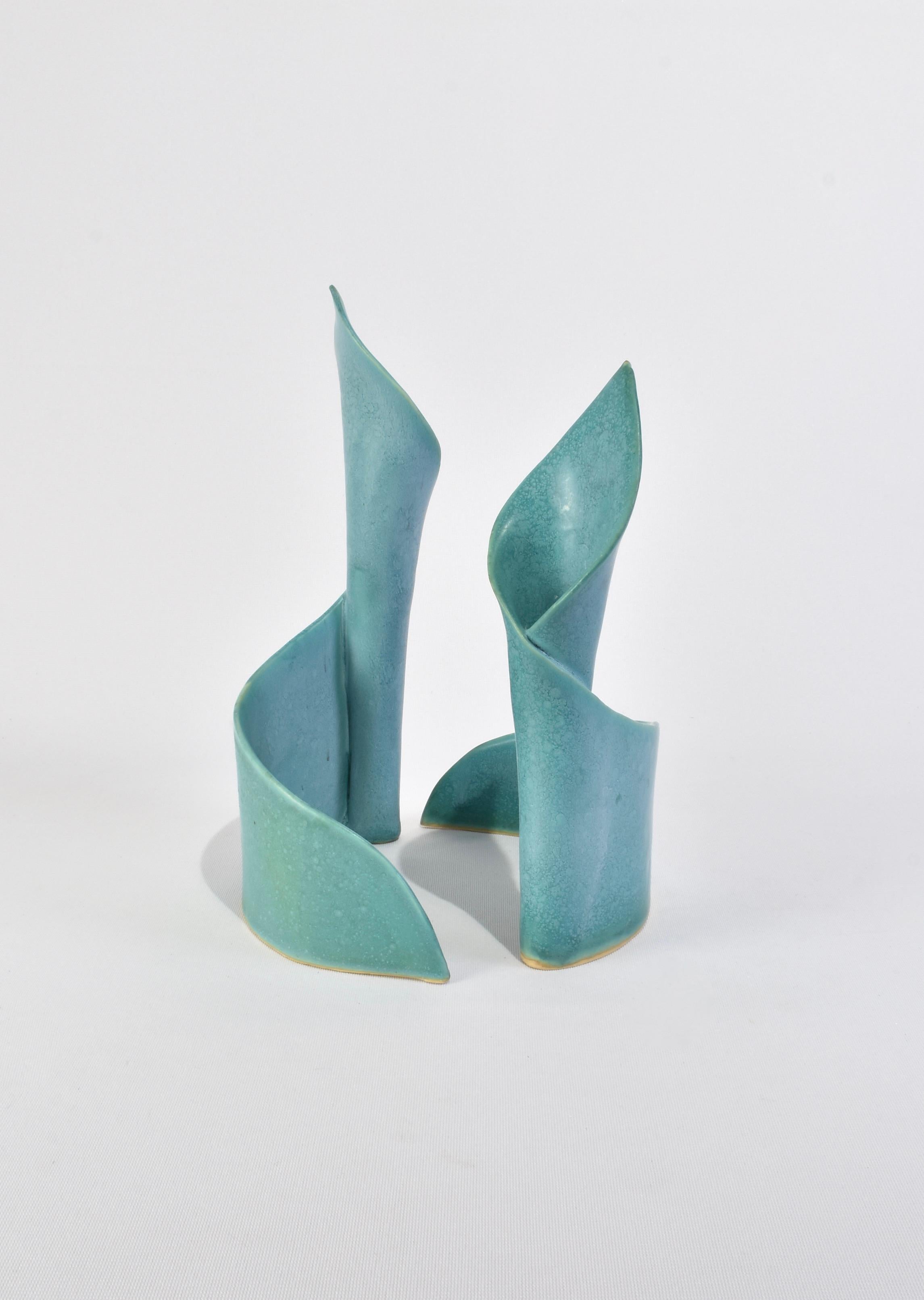 Stunning, handmade aqua ceramic candleholder set in a curved shape reminiscent of a calla lily.