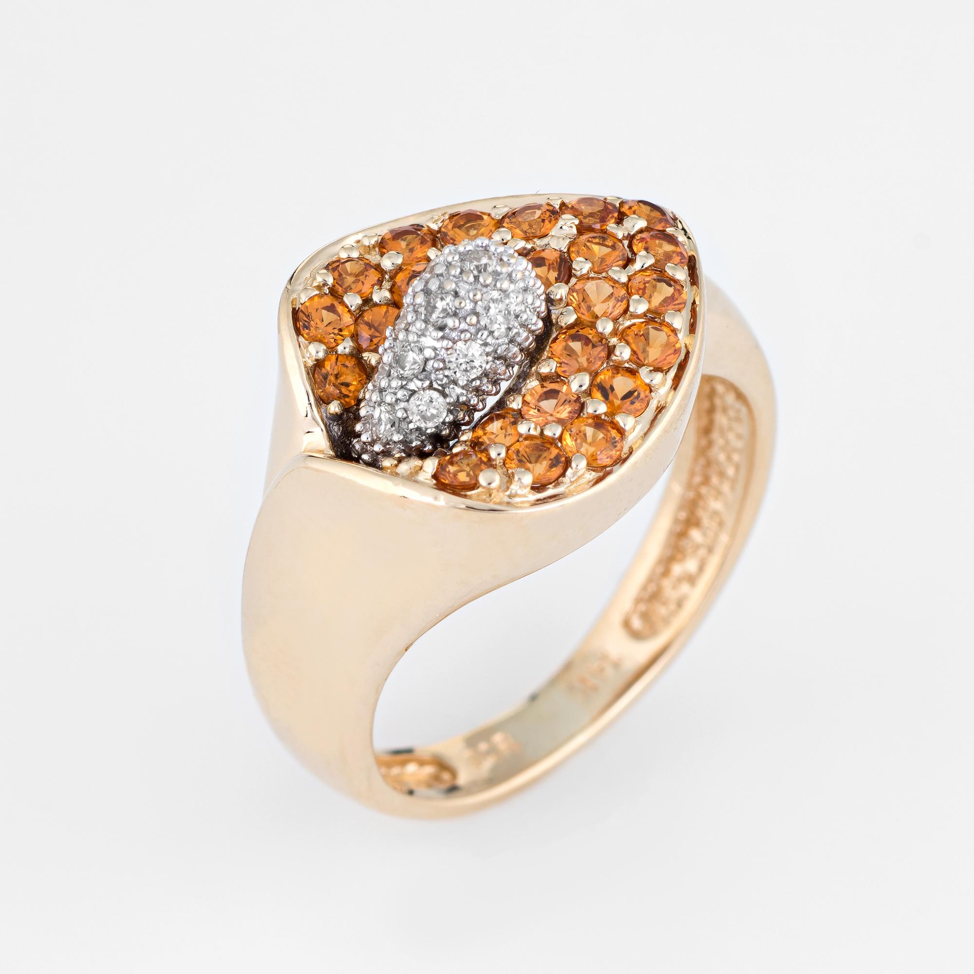 Finely detailed estate calla lily citrine & diamond cocktail ring, crafted in 14 karat yellow gold. 

25 citrines are estimated at 0.02 carats each and total an estimated 0.50 carats. The diamonds total an estimated 0.05 carats (estimated at H-I