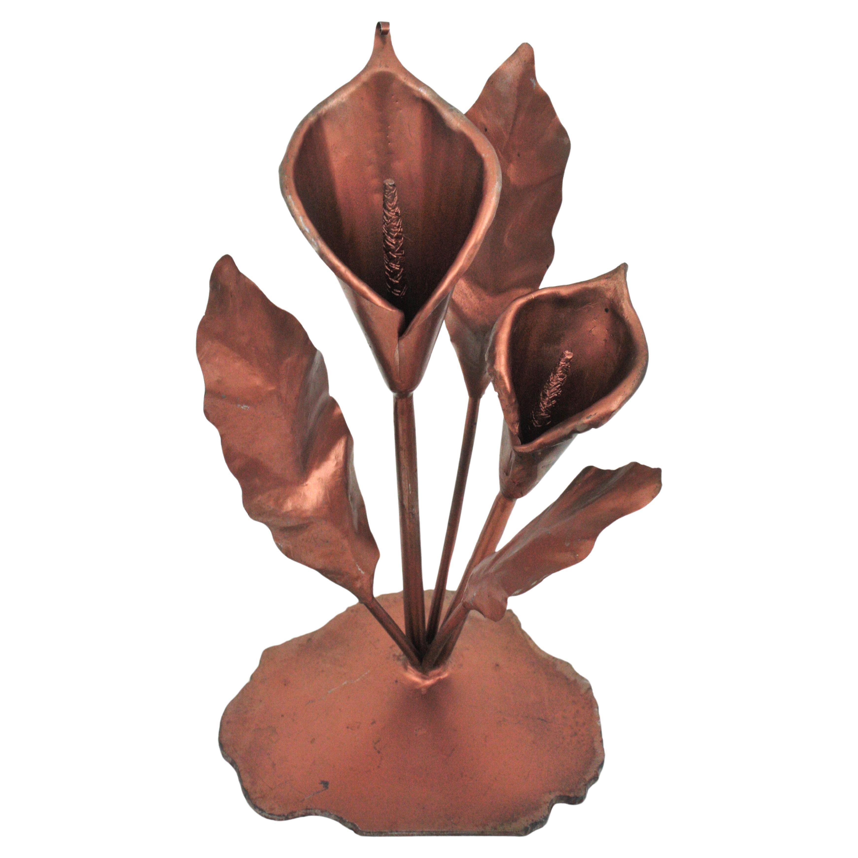 Metal Coppered Flower Sculpture / Paperweight, Spain, 1960s
Two Calla Lily flowers with leaves standing on a base. Metal coppered.
Minor wear according to its age.
To be used as decorative sculpture or paperweight.
Great gift idea.
Overall measures: