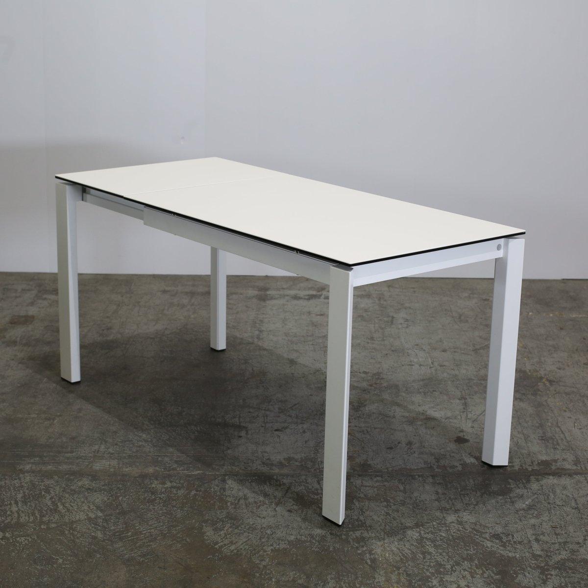 Elevate your dining experience with the Duca Extendable Dining Table by Calligaris. This classic piece features a sleek and modern design, with uniquely structured legs. Perfect for hosting dinner parties or family gatherings, the Duca table can