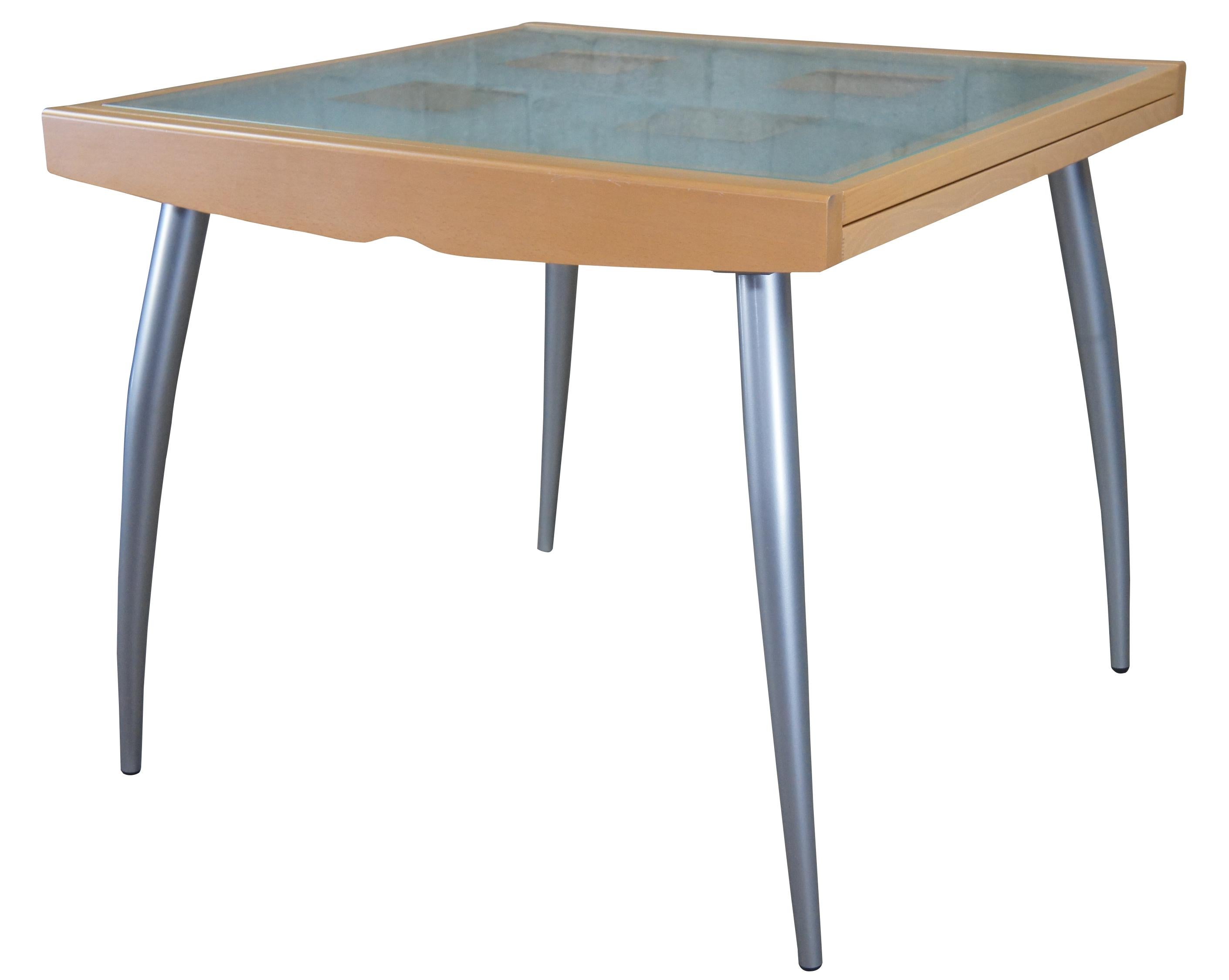 Calligaris 'Bon Ton' extendable dining table or desk.
The table features a frame in solid wood with inset glass tops.
