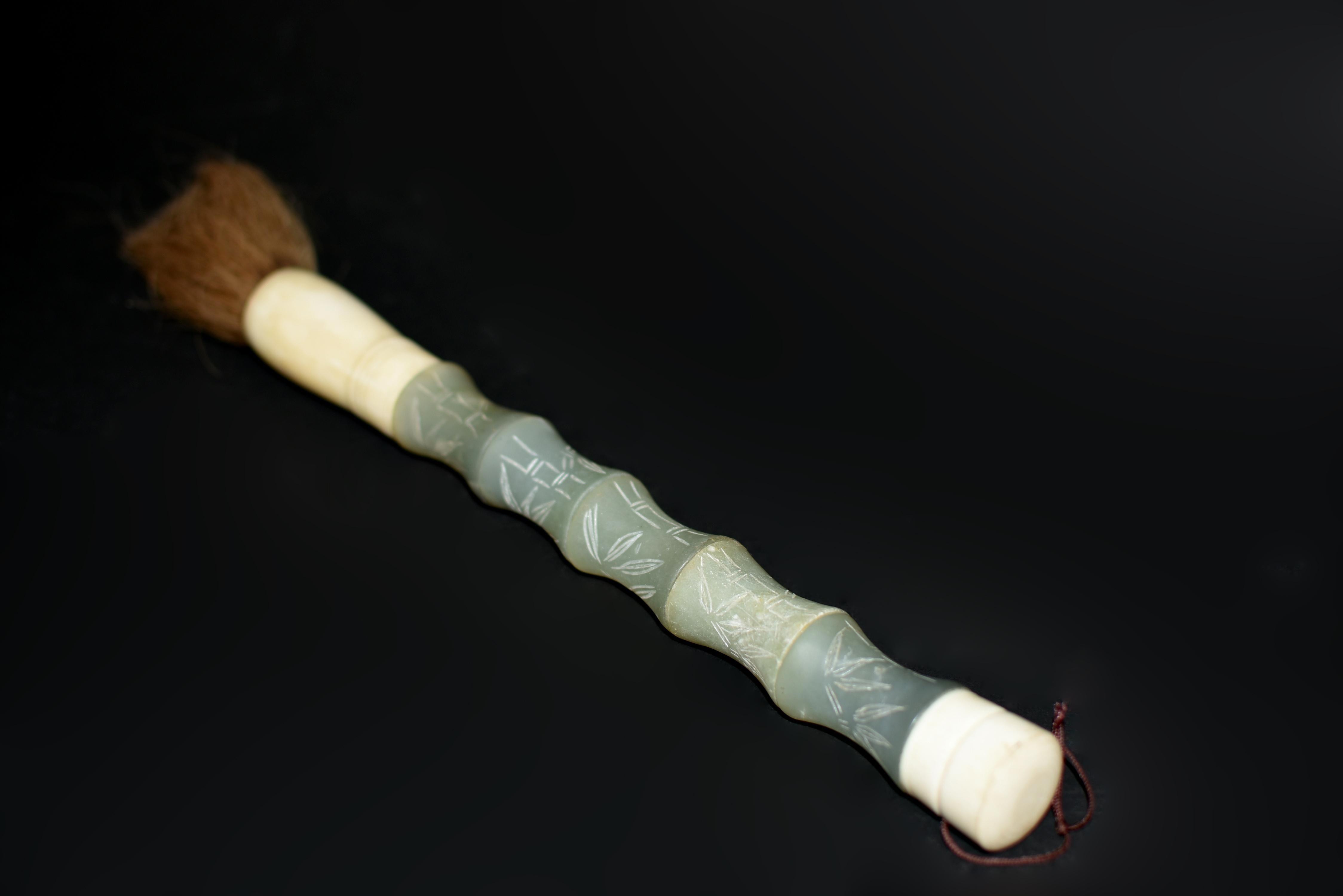 One of a kind, extra large, rare blue serpentine gemstone brush in bamboo form with carved bamboo leaves. Serpentine is a beautiful stone highly valued for its similarity to nephrite jade in its color and lustrous texture. Hand crafted with Bone