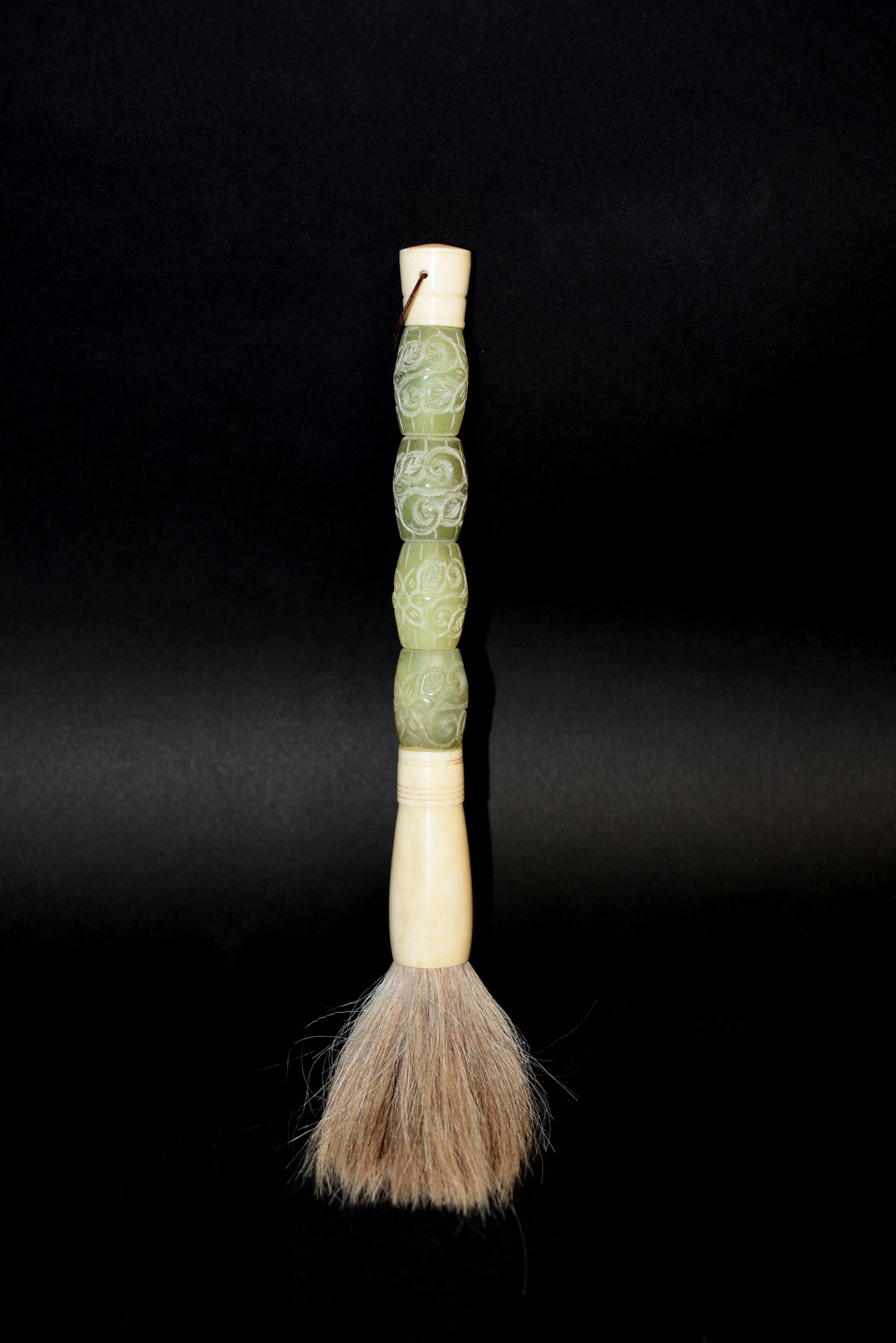 A beautiful, one of a kind, hand carved serpentine gemstone brush. Serpentine is a beautiful stone highly valued for its similarity to nephrite jade in its color and lustrous texture. Carved scroll work. Hand crafted with Bone ferrule and horse hair.