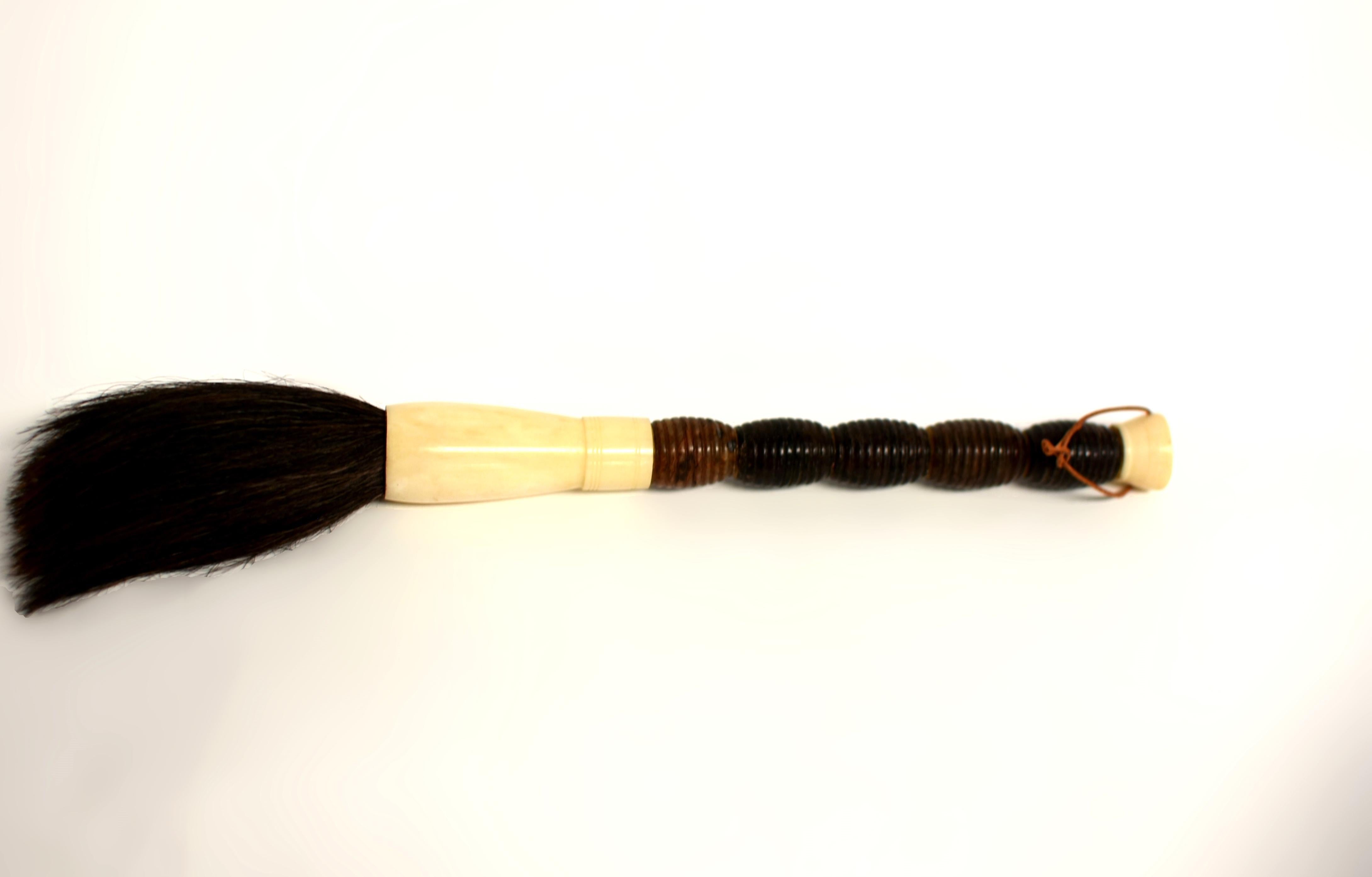 Crafted with a handle of natural jasper, this calligraphy brush highlights the stone's inherent beauty. Natural jasper has been expertly cut to display artistic swirls and polished to accentuate its natural markings. Finished with a bone ferrule and