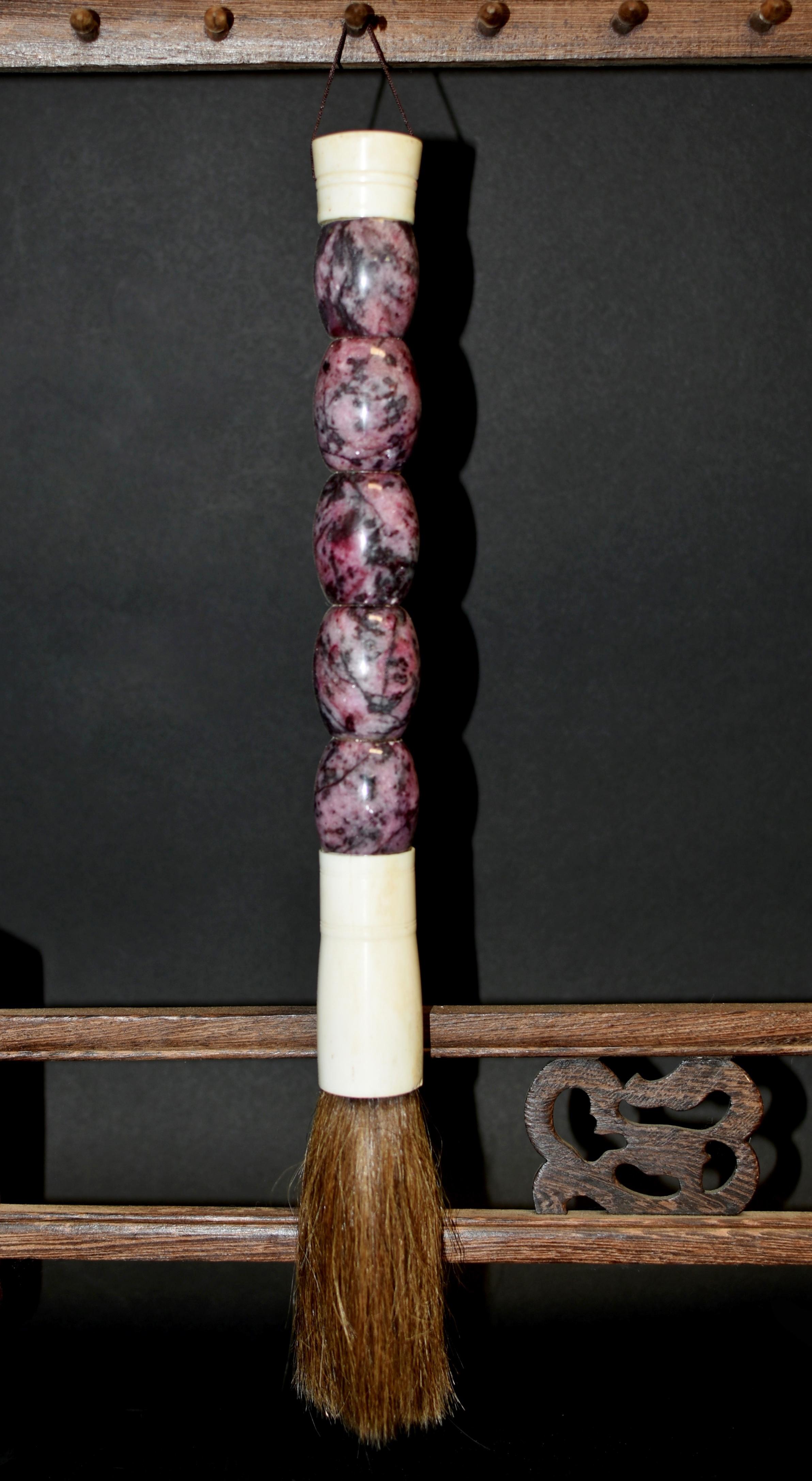 This is a very rare brush made with 5 rose pink rhodonite gemstones, each stone measuring at 1.25