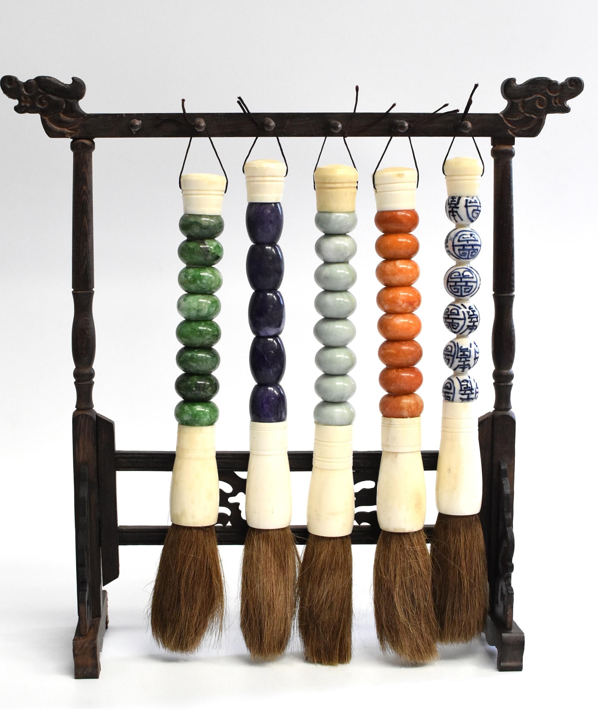 Beautiful set of 5 large Chinese calligraphy brushes with handmade stone and porcelain handles. The collection consists 4 brushes with quartz stone handles and 1 with blue and white double happiness porcelain ball handle. Brushes are handmade with