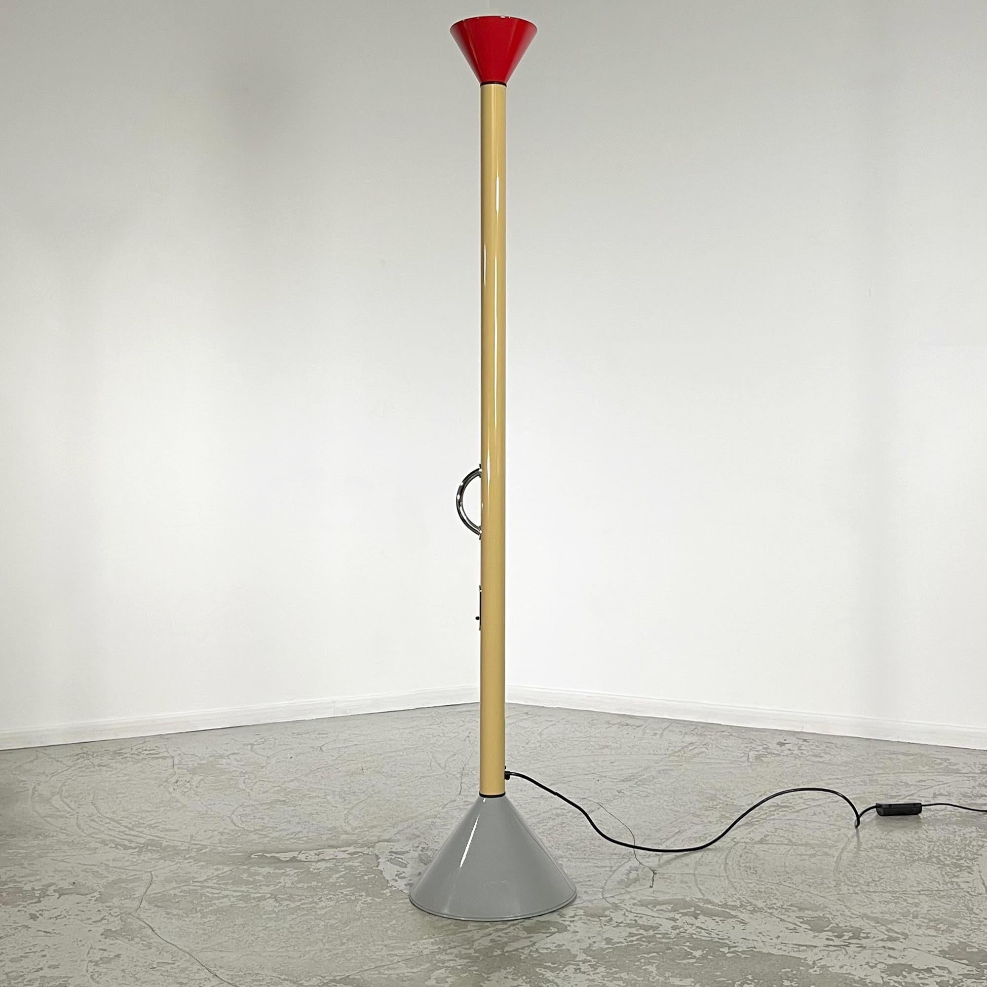 This floor lamp was designed by the famous designer Ettore Sotsass for the Italian publishing house Artemide in 1982. In 1981, the designer founded Memphis. With the financial support of Artemide's boss, the group became an immediate success.