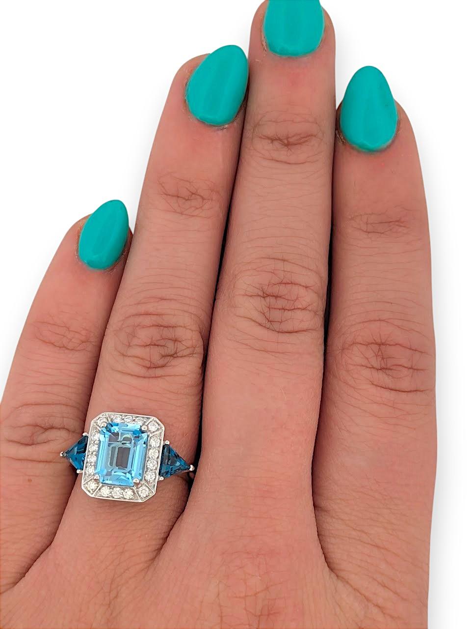 La bague Calliope allie couleurs vives et savoir-faire raffiné. Elle est conçue pour éblouir. Sertie dans de l'or blanc 18 carats lumineux, cette magnifique bague est ornée d'une captivante topaze bleue naturelle de 2,63 carats taillée en émeraude,