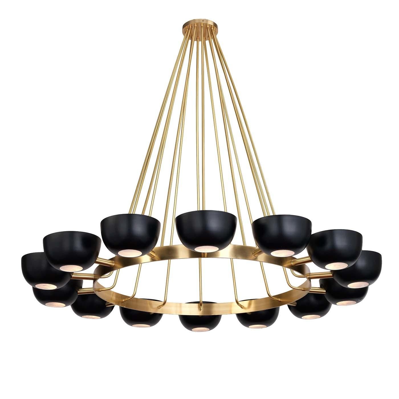 An exercise in balance and sophistication, this chandelier is an ideal decoration for a large living room when placed above a stately dining table. The structure is in brass with a natural finish and comprises a round base with 14 arms stemming from
