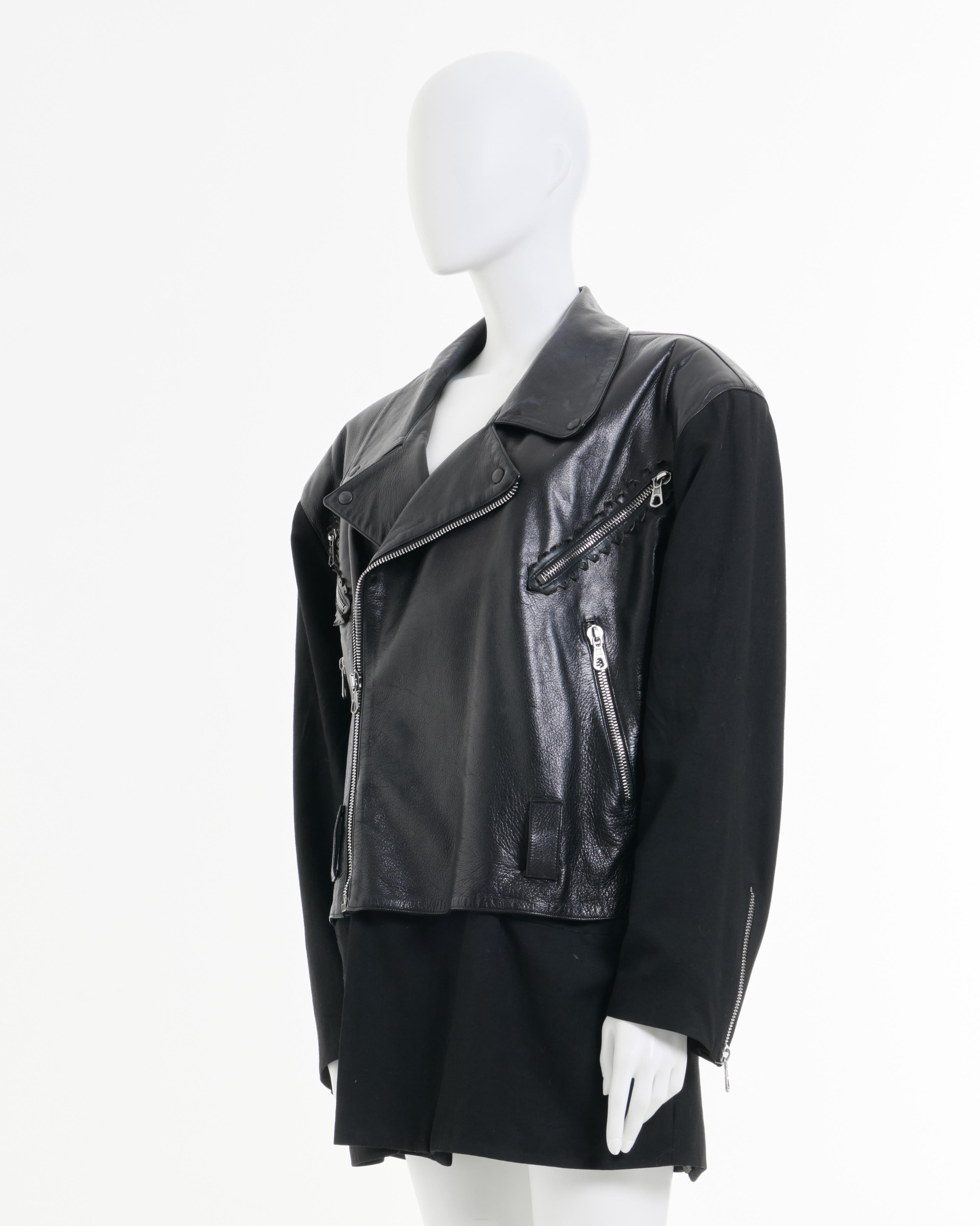 - Designed by Calugi e Giannelli
- 90’s Period
- Black Biker Jacket
- Asymmetric Zip Closure
- Zipped Multi Pockets
- Double Layered 
- First Layer in Leather
- Second Layer in Cotton
- Made in Italy
- Excellent Condition
- Materials: Leather -