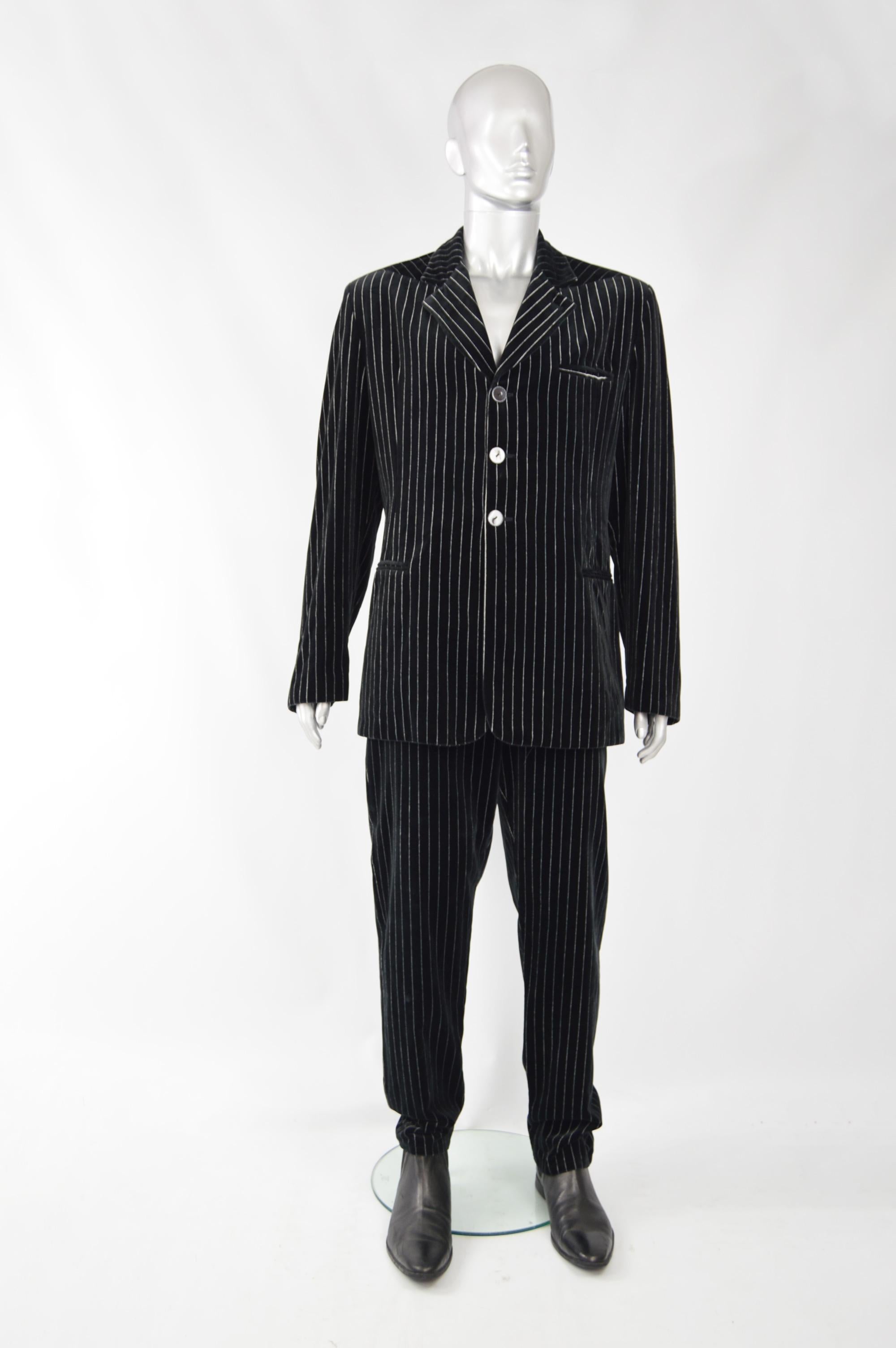 An amazing vintage mens suit from the 80s by genius Italian fashion designer duo, Calugi e Giannelli. In a black velvet with grey pinstripe running throughout. 

Size: Jacket Marked 54, Trousers 52 but the jacket fits like a Large and the trousers