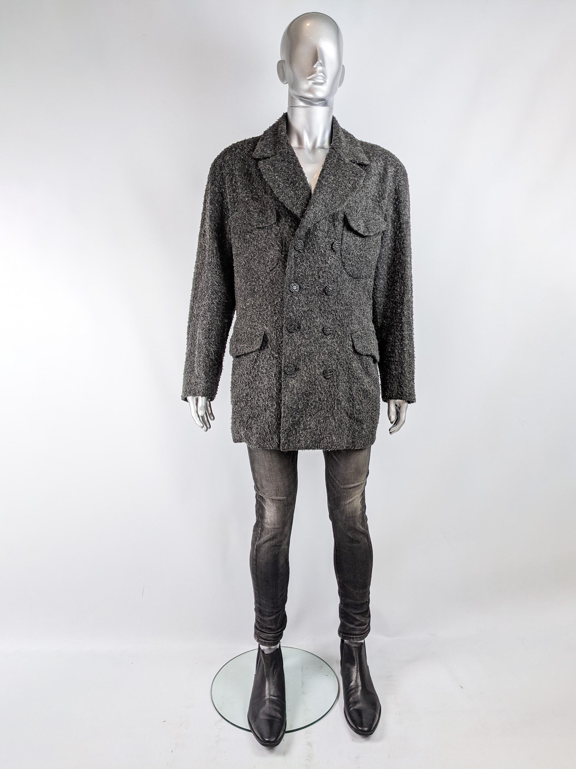 A stylish and rare Calugi e Giannelli jacket from the 80s in a fuzzy grey wool and mohair tweed with four patch pockets on the front and double breasted buttons. 

Size: Marked IT 52 which equates to an XL
Chest - 46” / 117cm (allow 2-4