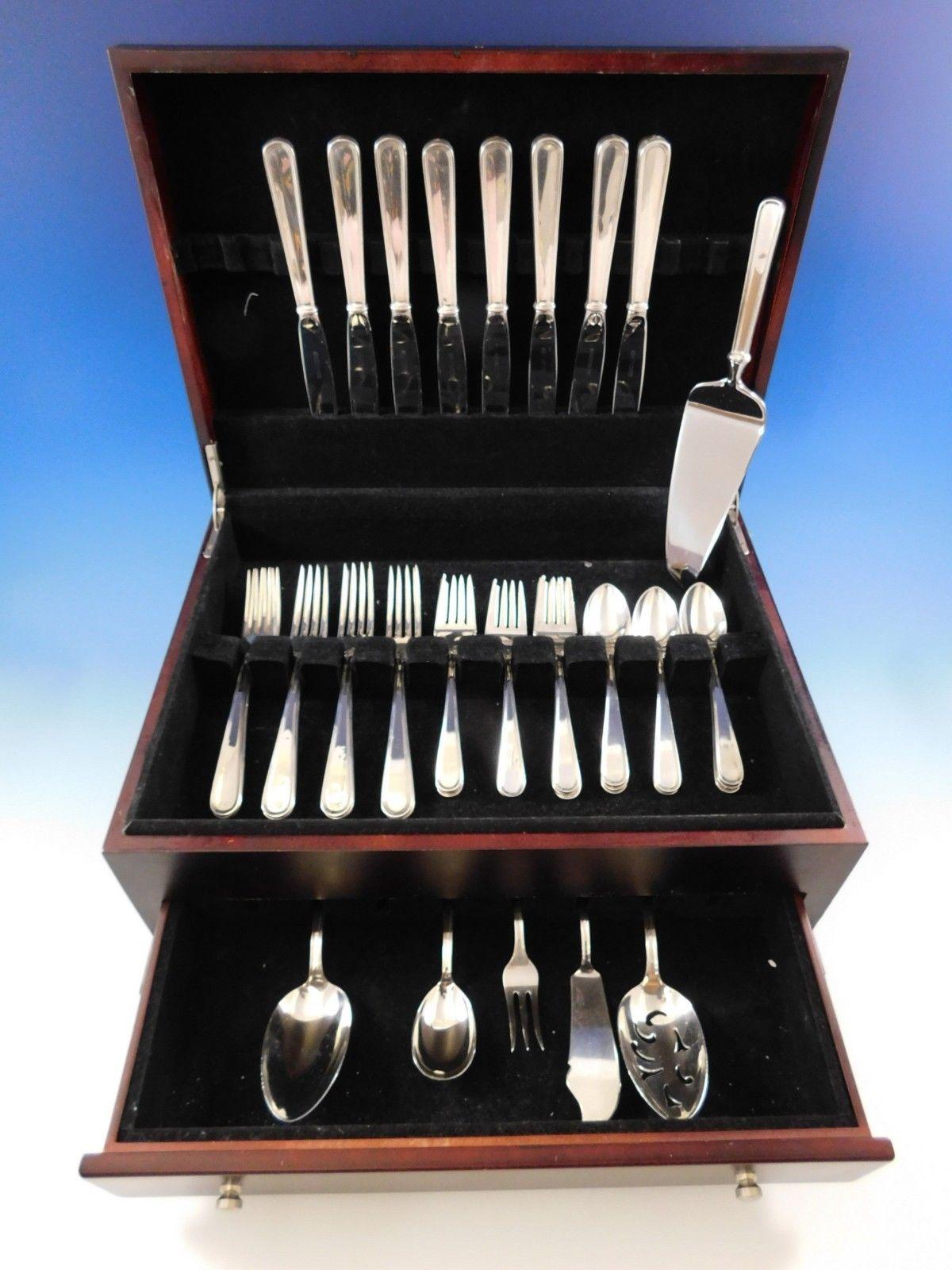 Beautifully simple Calvert by Kirk & Son. sterling silver flatware set of 38 pieces. This set includes:

8 knives, 9