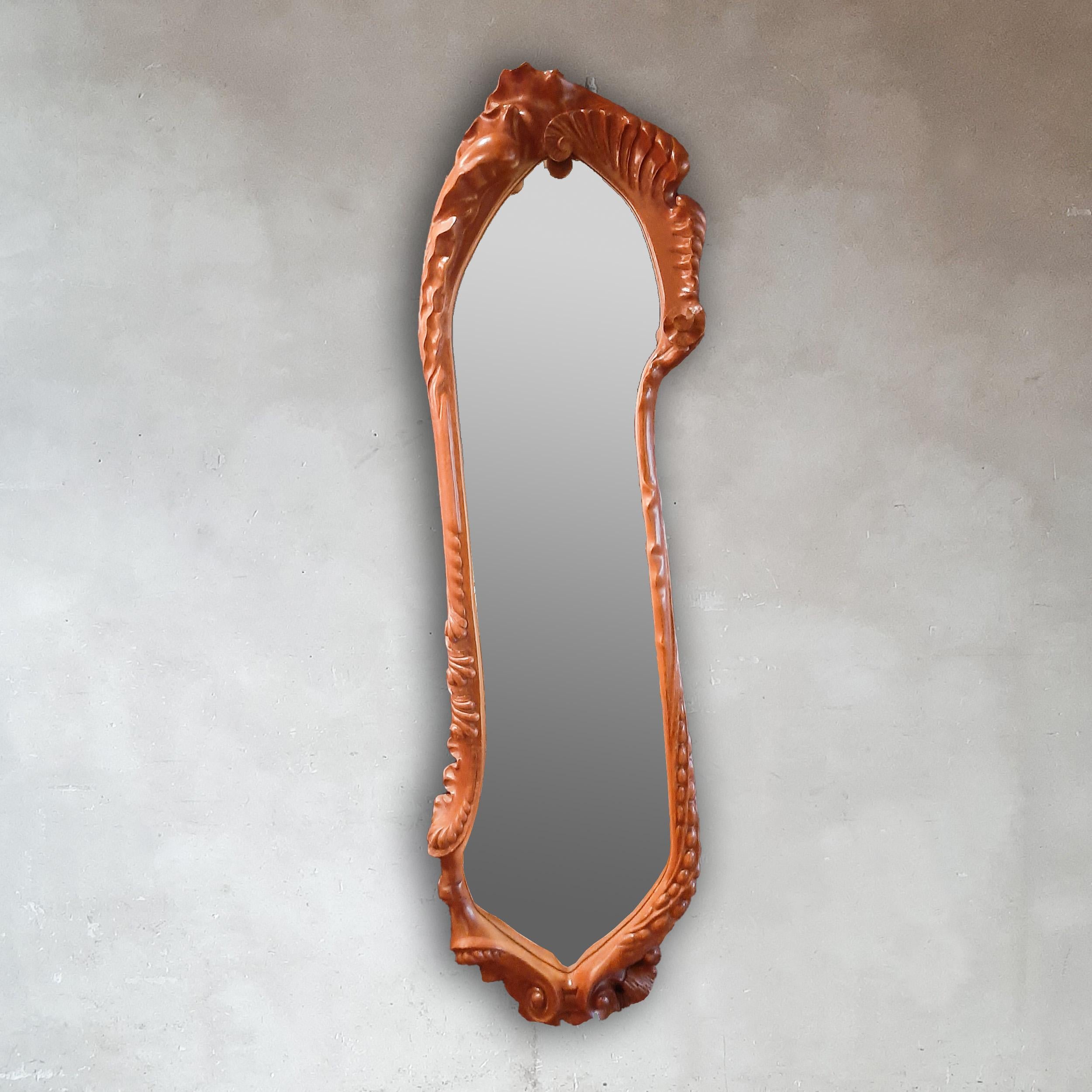 Calvet mirror in wood designed by Antoni Gaudí for BD Barcelona. This Art Nouveau style mirror was designed by Gaudí in the period 1890-1919 and was produced in the late 1990s by the Spanish company BD Barcelona. The frame is made of handcut brown