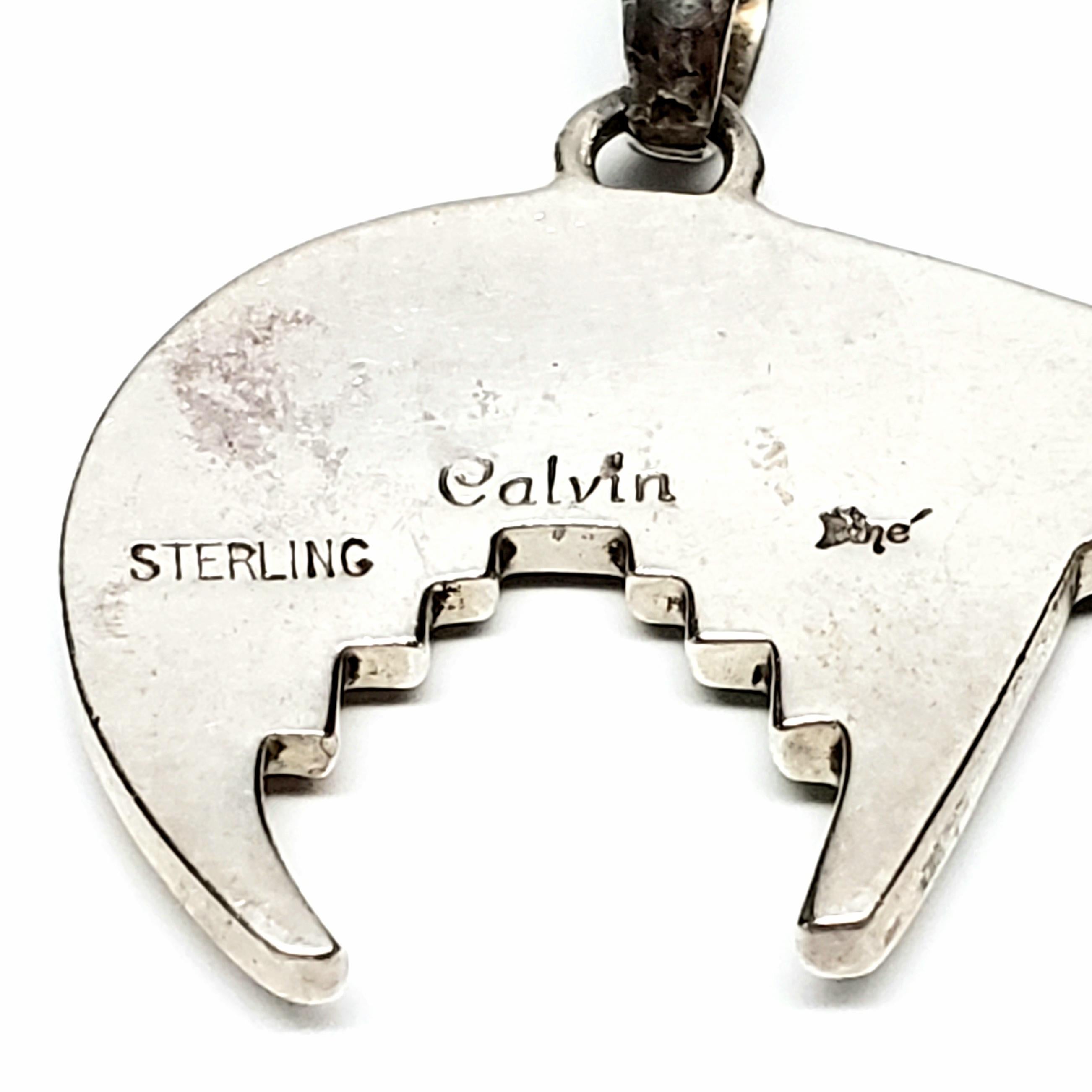 Sterling silver and inlay mosaic bear pendant by Native American artisan Calvin Begay.

Calvin Begay has been a jewelry designer and master craftsman for 20+ years, using traditional Navajo inlay techniques that reflect his heritage. His pieces are