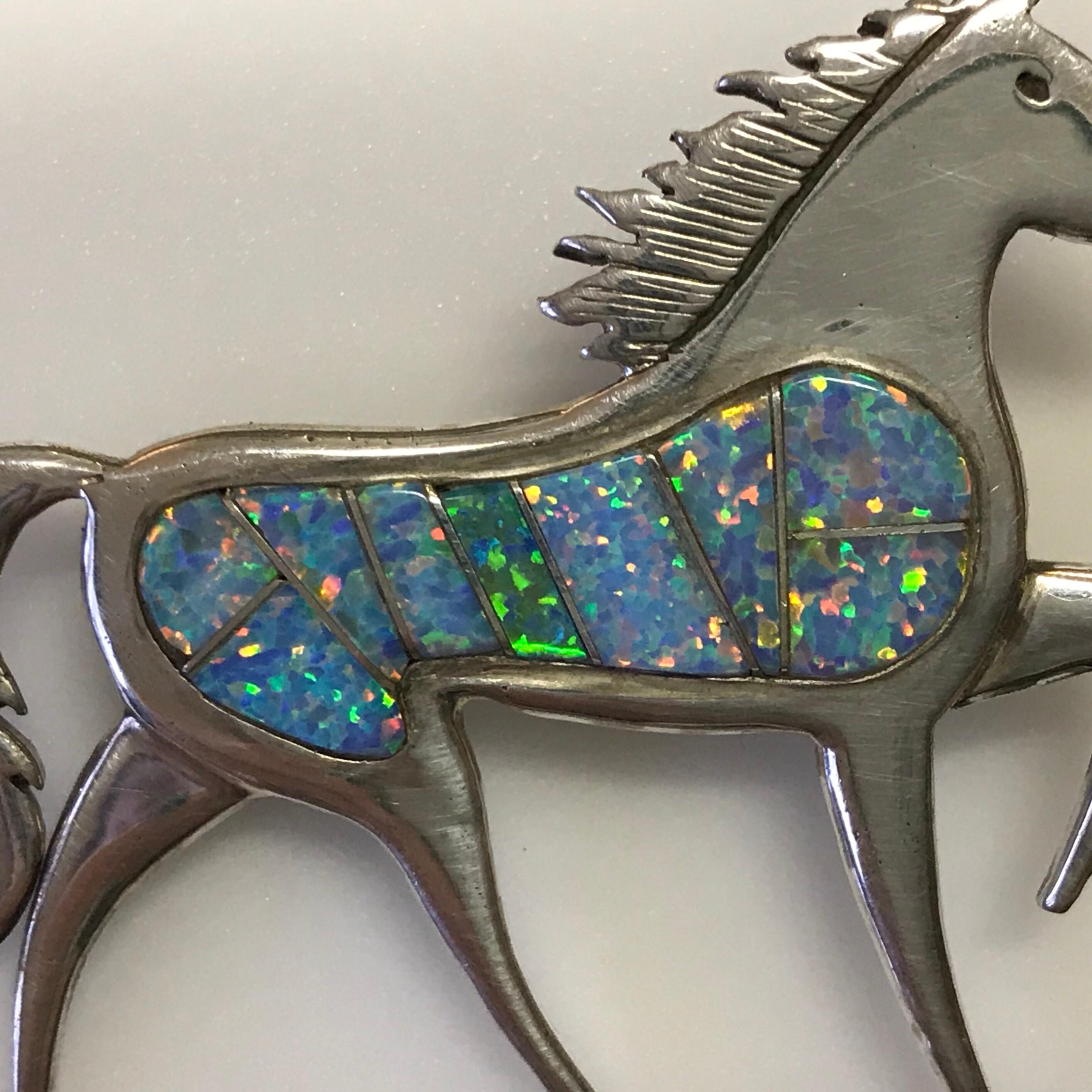 This fire opal mosaic & sterling stallion brooch is a designer original by an American Navajo Indian artist, Calvin Begay. He is known for creating 