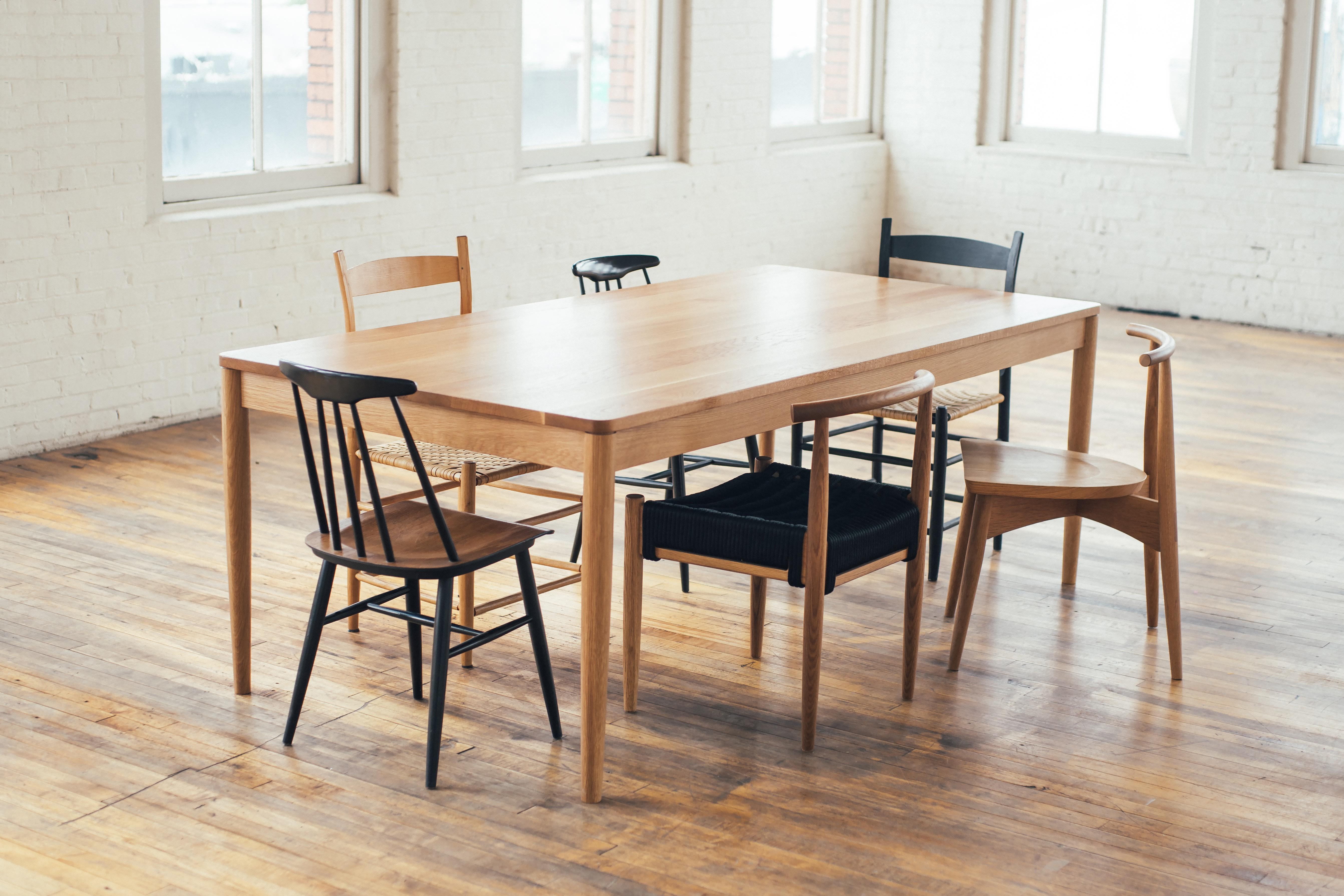 Originally designed as a dining table for a growing family, the Calvin Family Table was inspired by old farmhouse tables: simple and graceful, yet utilitarian. Calvin’s legs are set all the way out into the far corners to leave ample leg room. Each