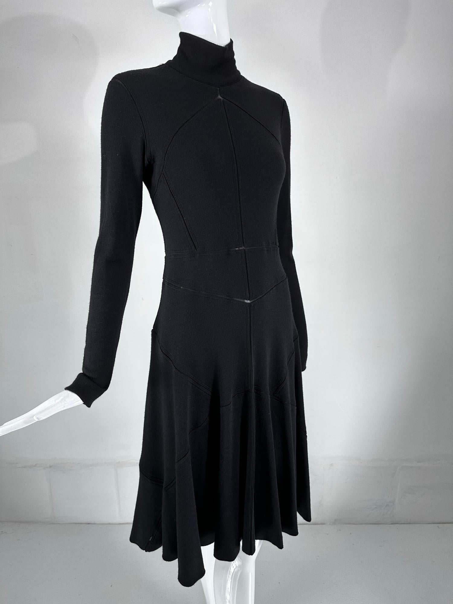Classic Calvin Klein black cashmere/wool blend bias, peek-a-boo seam dress. Vintage Klein at his best, this dress is sophisticated and perfect for day to evening. Turtle neck, with long fitted sleeves, the dress if fitted through the torso, skims