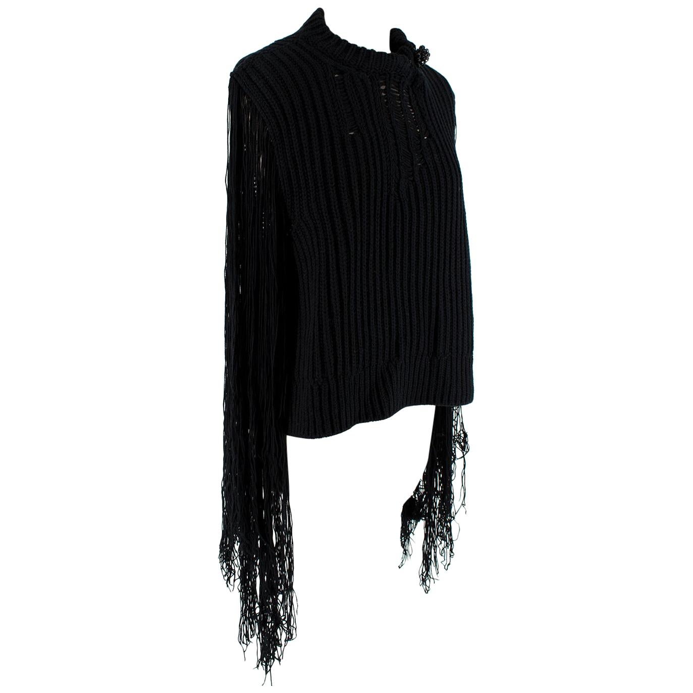 Calvin Klein 205W39NYC Black Fringed Jumper

- Detachable crystal brooch
- Distressed 
- Fringe sleeves and loose knit
- Mock neck collar with button and clasp 
- Semi sheer
- Oversized
- Mid weight

Materials: 
100% Acrylic

Made in Italy