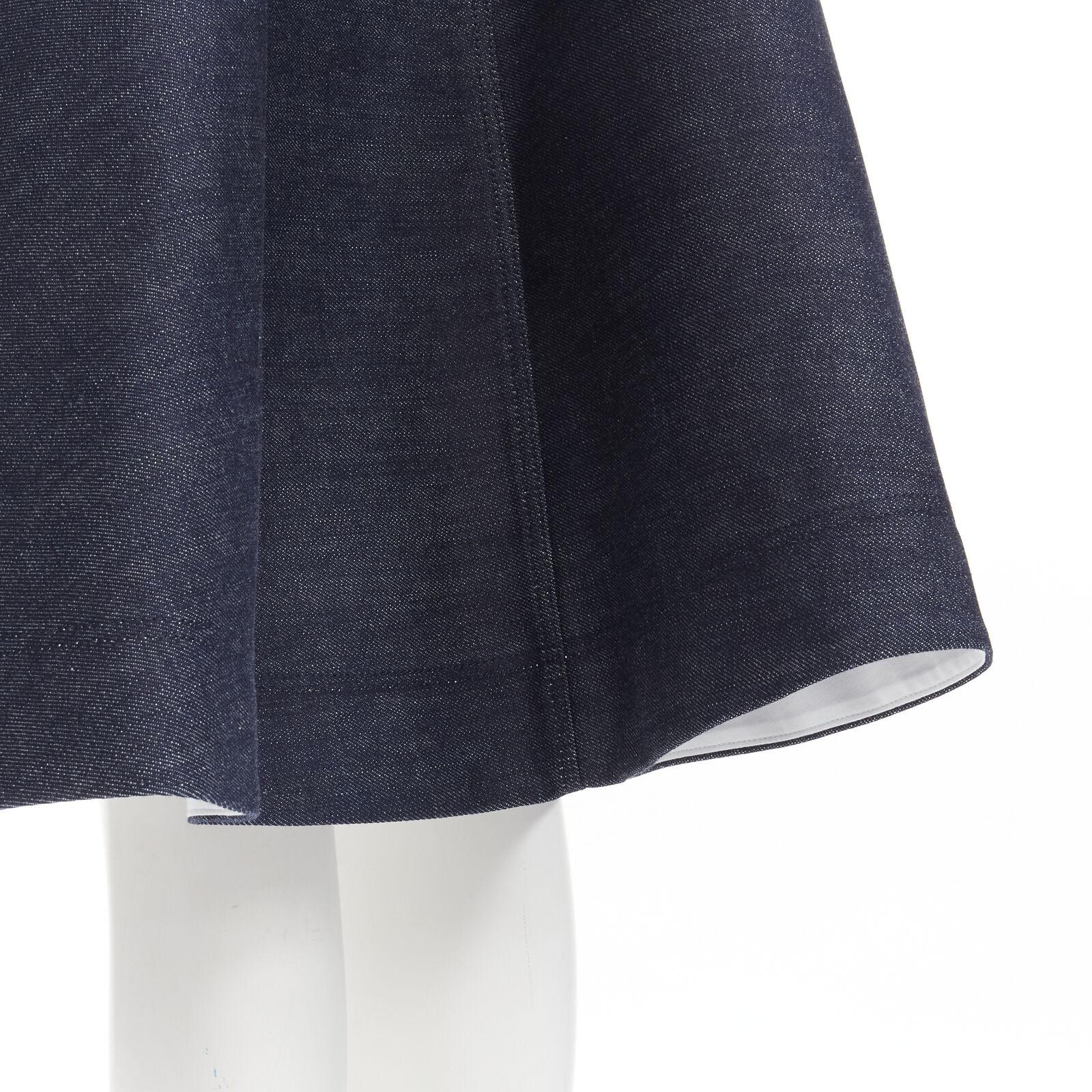 CALVIN KLEIN 205W39NYC navy minimal structural A-line denim flared skirt US2 S
Reference: AAWC/A00331
Brand: Calvin Klein
Designer: Raf Simons
Collection: 205W39NYC
Material: Cotton
Color: Blue
Pattern: Solid
Closure: Zip
Lining: Partially