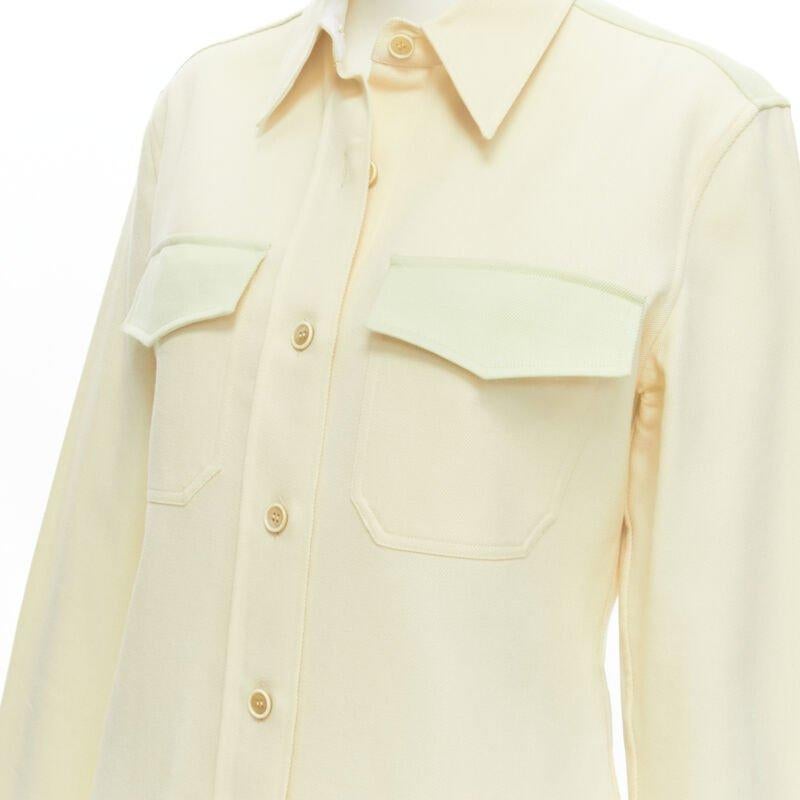 CALVIN KLEIN 205W39NYC Raf Simons yellow green western flap pocket shirt US6 S
Reference: CLYG/A00048
Brand: Calvin Klein
Designer: Raf Simons
Material: Cotton
Color: Yellow, Green
Pattern: Solid
Closure: Button
Extra Details: Flap pockets at chest.