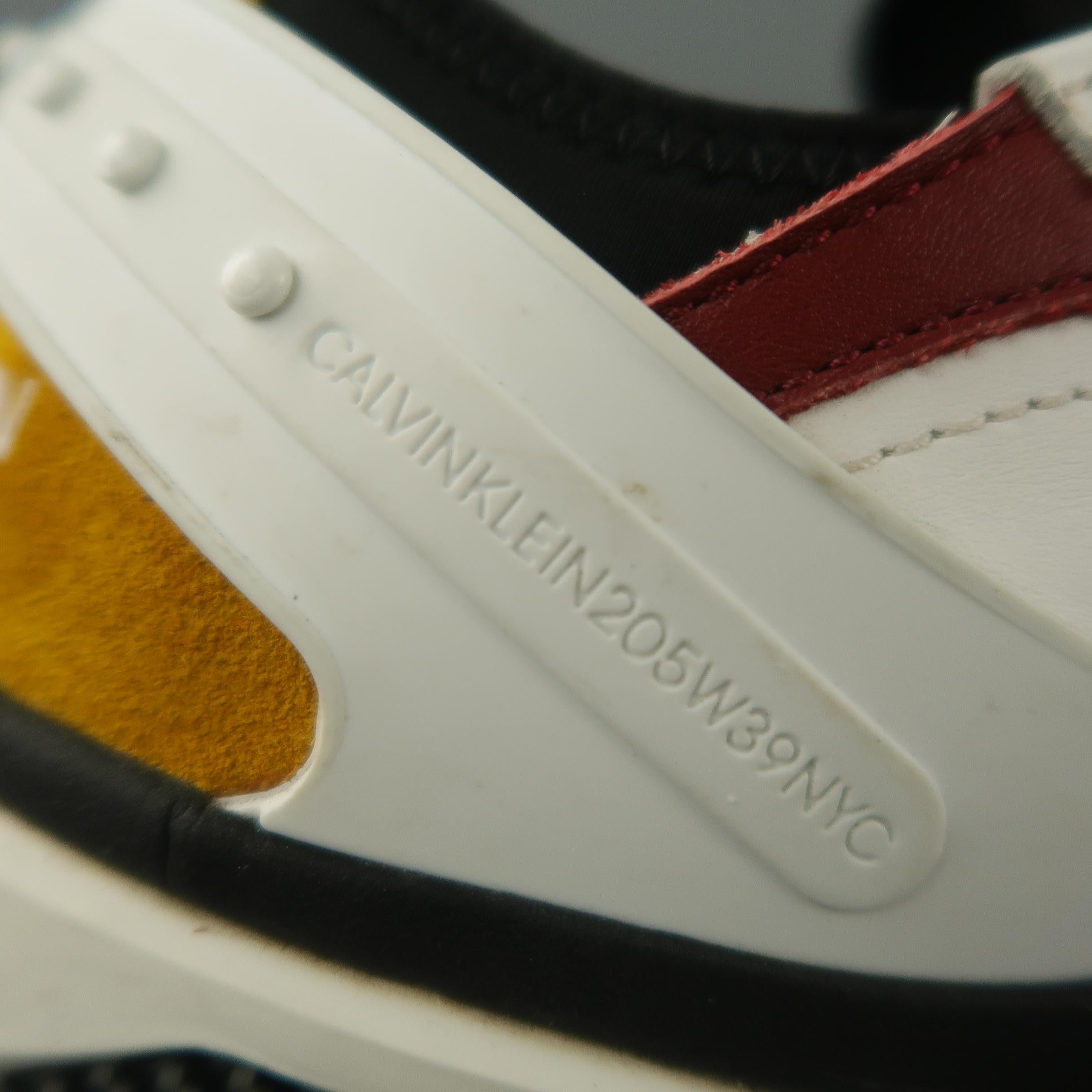 CALVIN KLEIN 205W39NYC CARLOS 10 by RAF SIMMONS sneaker comes in a white leather, red & yellow color block leather trim details featuring a adjustable strap, and a rubber sole. Comes with box. Made in Italy.
 
Excellent Pre-Owned Condition.
Original