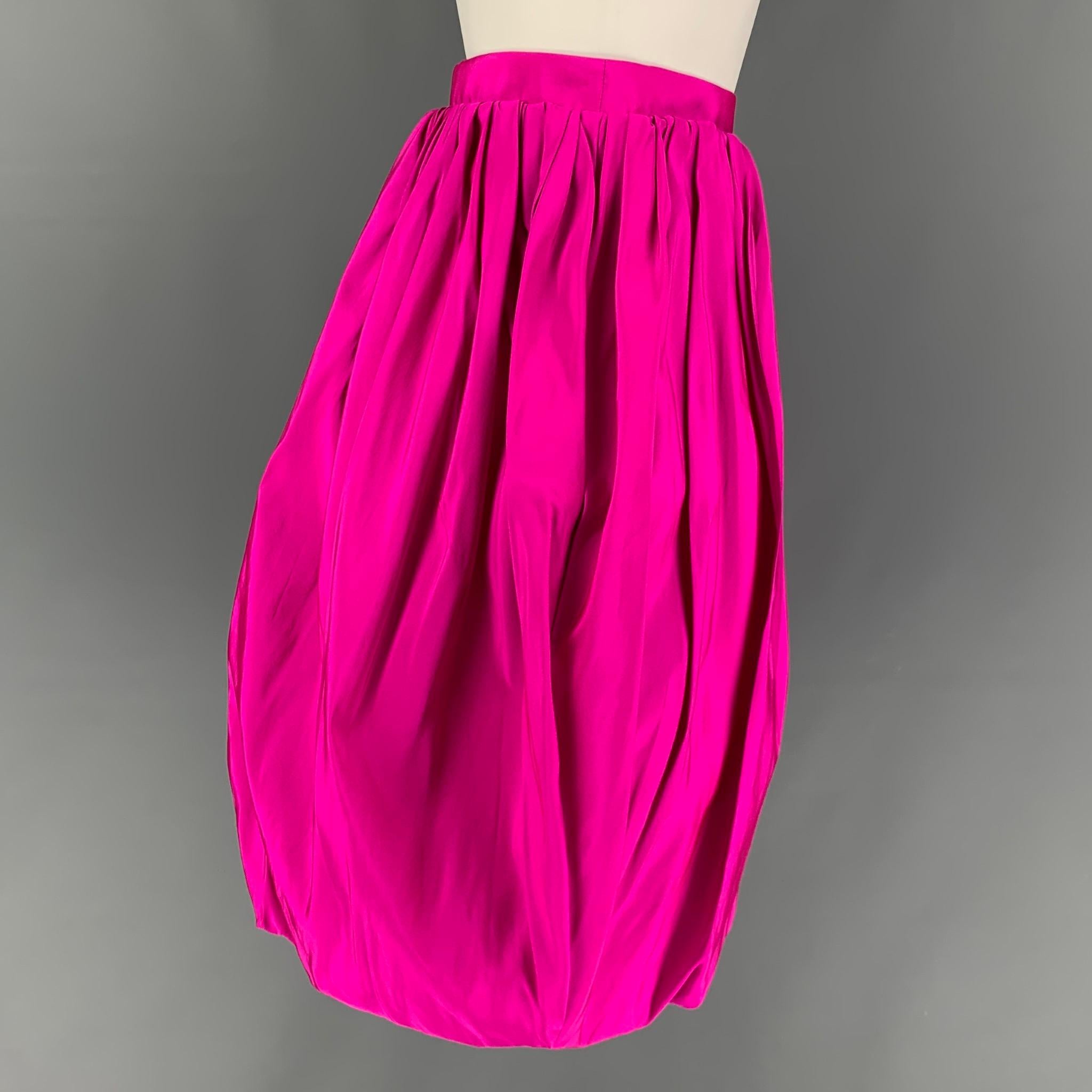 CALVIN KLEIN 205W39NYC skirt comes in a pink silk featuring a pleated style, elastic detail, and a side front tab & snap button closure. Made in Italy. 

New With Tags. 
Marked: 2

Measurements:

Waist: 26 in.
Hip: 40 in.
Length: 23 in.
 